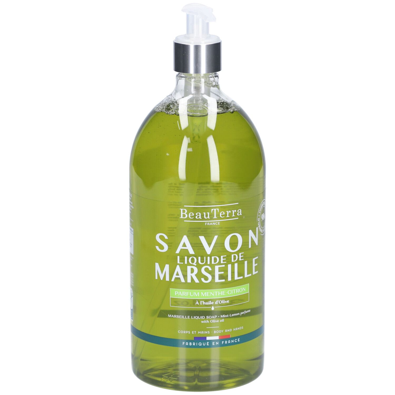 Grüne Flüssigseife in einer transparenten Flasche mit Spender. Aufschrift: Savon Liquide de Marseille. Minze Zitrone.