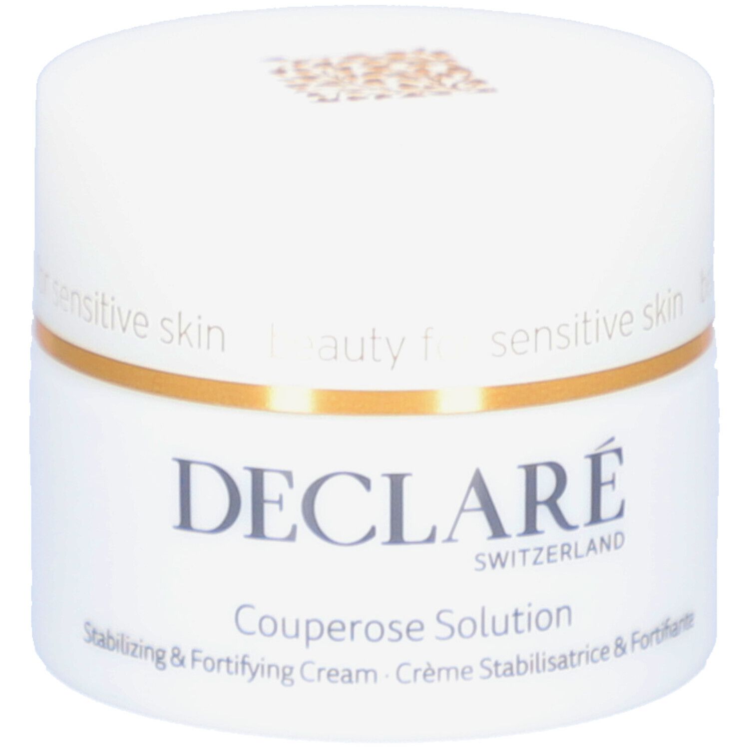 Pot blanc avec anneau doré. Inscription : DECLARÉ SWITZERLAND Couperose Solution. Crème stabilisatrice & fortifiante.
