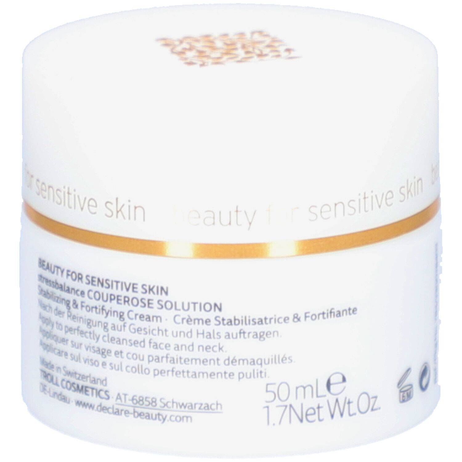 Pot blanc avec anneau doré. Inscription : DECLARÉ SWITZERLAND Couperose Solution. Crème stabilisatrice & fortifiante.