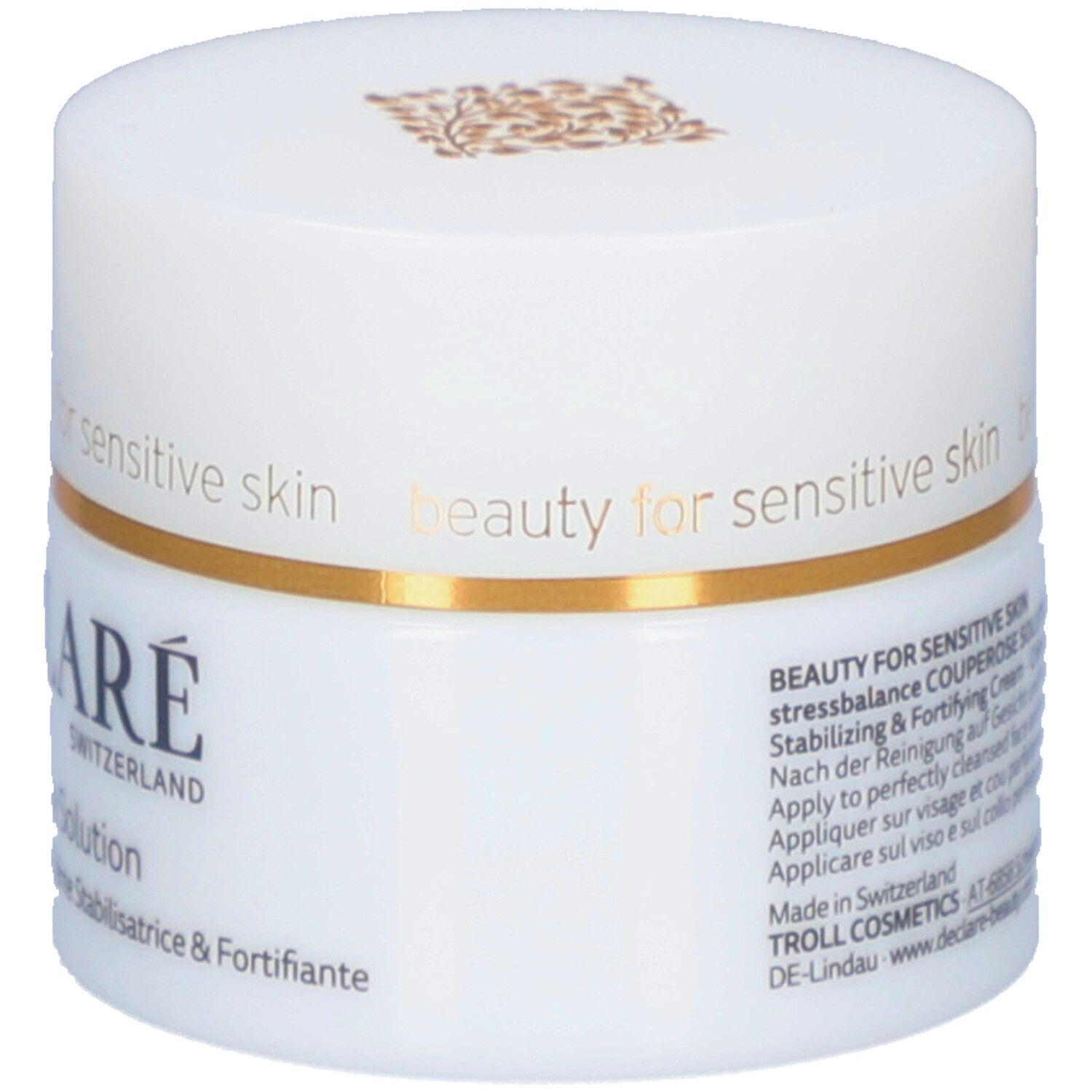 Pot blanc avec anneau doré. Inscription : DECLARÉ SWITZERLAND Couperose Solution. Crème stabilisatrice & fortifiante.