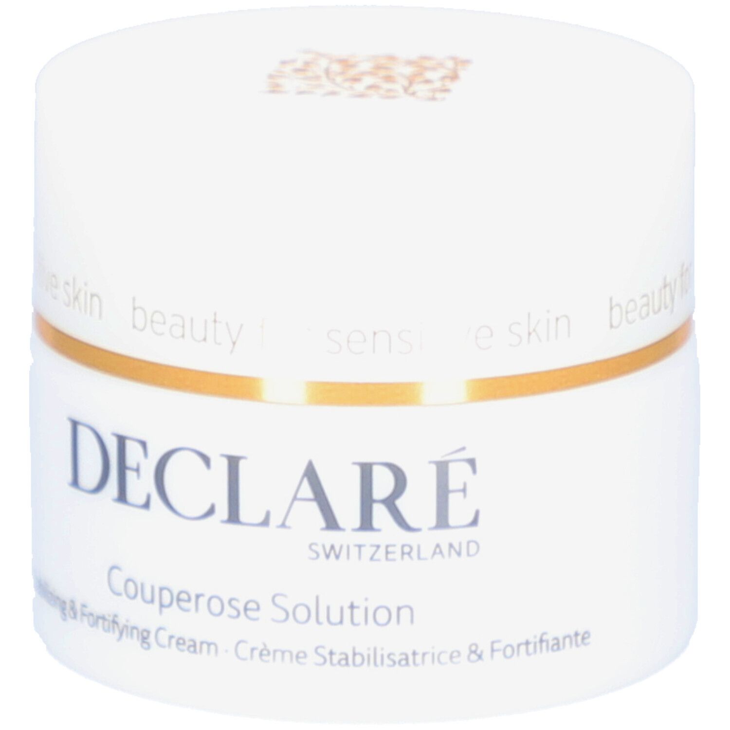 Pot blanc avec anneau doré. Inscription : DECLARÉ SWITZERLAND Couperose Solution. Crème stabilisatrice & fortifiante.
