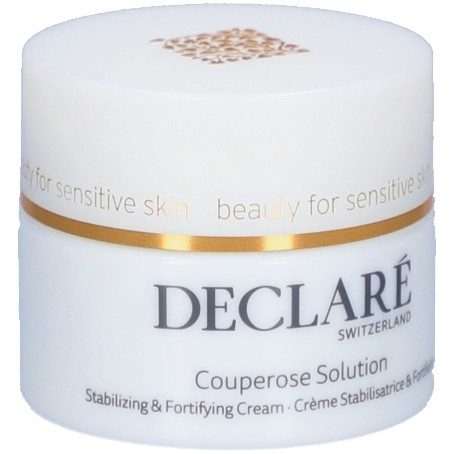 Pot blanc avec anneau doré. Inscription : DECLARÉ SWITZERLAND Couperose Solution. Crème stabilisatrice & fortifiante.