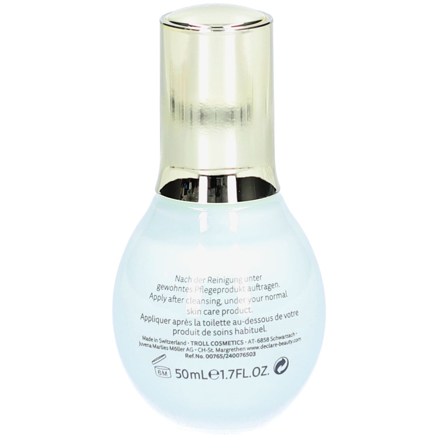 Flacon bleu clair avec bouchon doré. Texte au dos en plusieurs langues, 50ml.