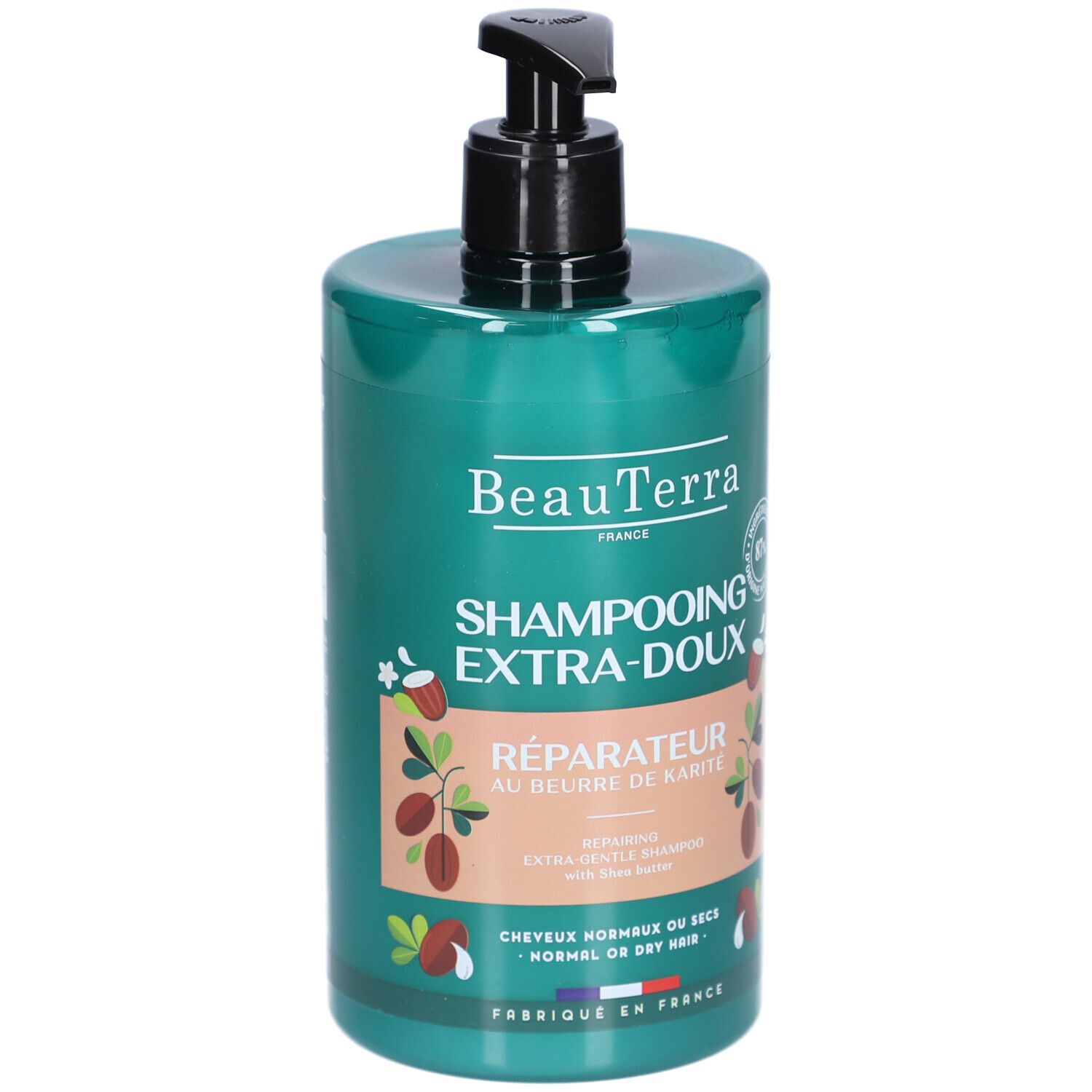 Flacon de shampooing vert avec pompe noire. Inscriptions: BeauTerra, Shampooing Extra-Doux, Réparateur au beurre de Karité. Pour cheveux normaux ou secs.