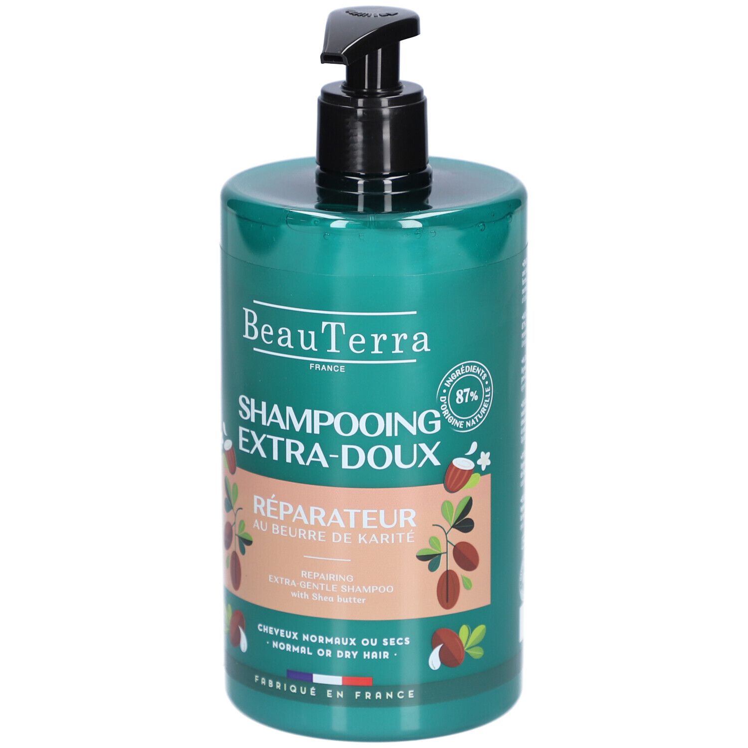 Flacon de shampooing vert avec pompe noire. Inscriptions: BeauTerra, Shampooing Extra-Doux, Réparateur au beurre de Karité. 87% ingrédients naturels.