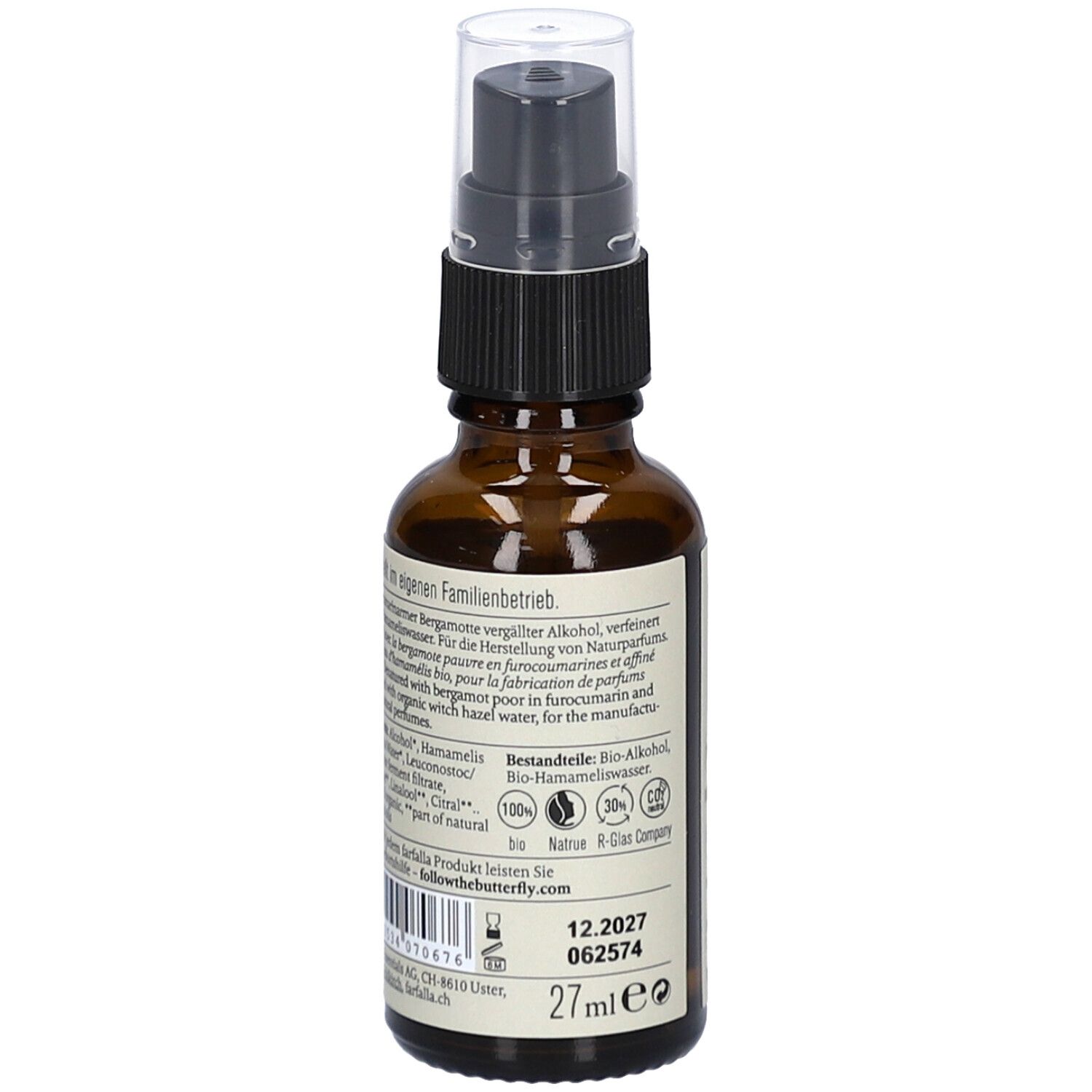 Braune Glasflasche mit Sprühkopf. Etikett mit Produktinformationen, Inhaltsstoffen und Chargennummer.