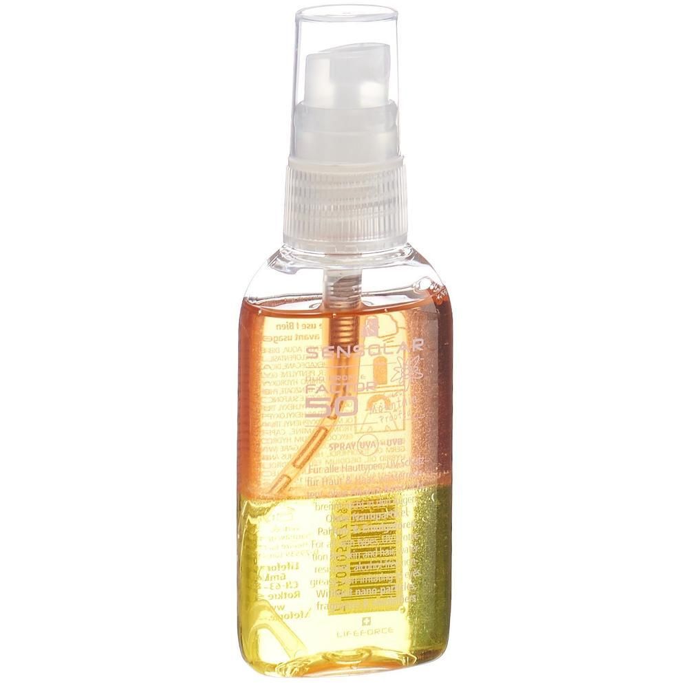 Transparente Flasche mit Sprühkopf. Zwei Flüssigkeiten, gelb und orange. Aufdrucke auf der Flasche.