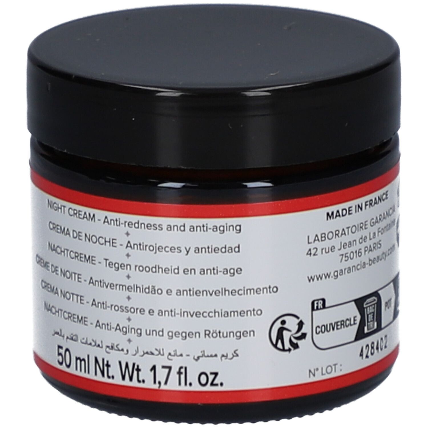 Creme-Glas mit schwarzem Deckel. Roter Aufkleber mit Text in mehreren Sprachen. Text: Night Cream, Crème de Nuit, Nachtcreme.