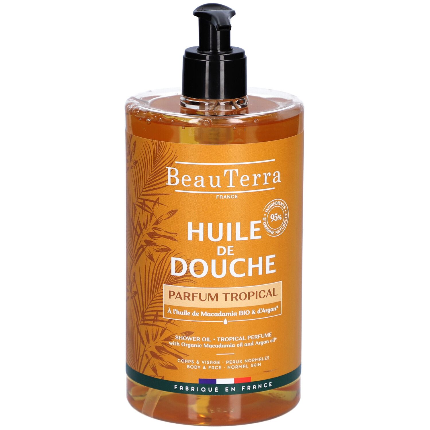 Flacon transparent avec pompe noire. Inscription : "Huile de Douche Parfum Tropical".