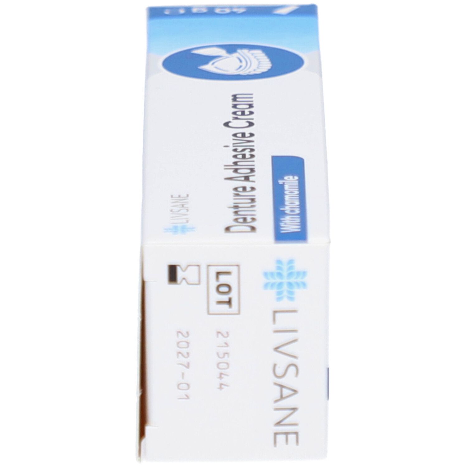 Schachtel mit Zahncreme, Seitenansicht. Aufschrift: Livsane, Denture Adhesive Cream, With chamomile. Chargennummer und Verfallsdatum.