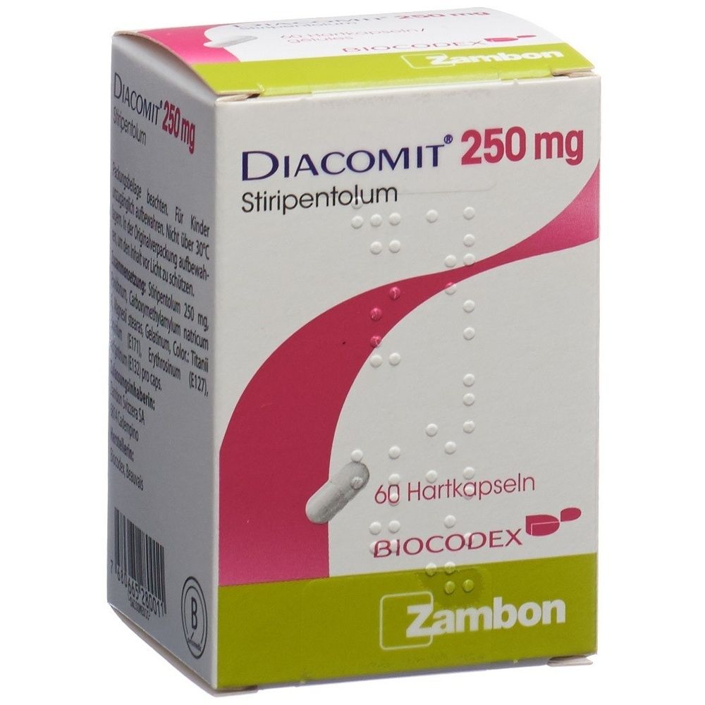 Karton mit Produktinformationen. Oben steht "DIACOMIT 250mg". Rosa und weiße Wellen auf grünem Hintergrund.
