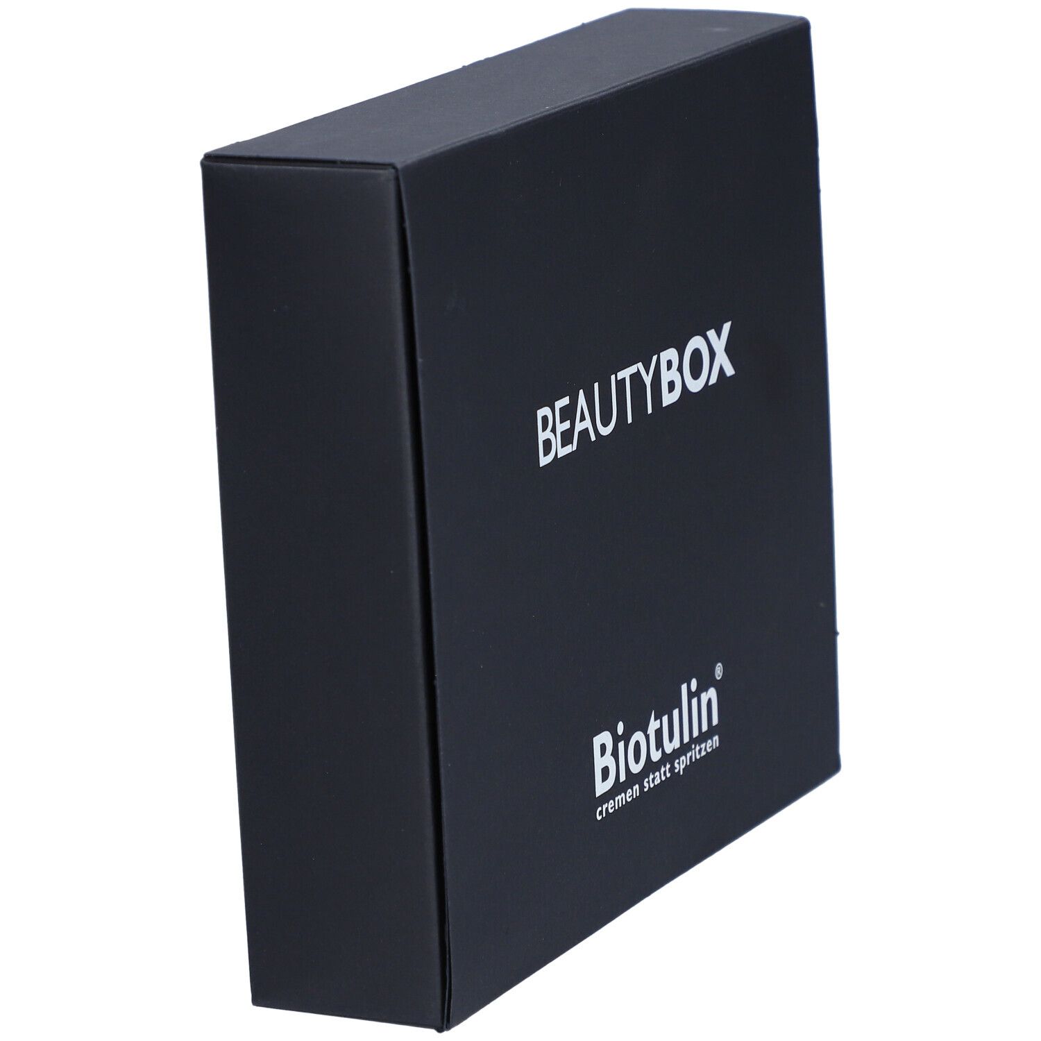 Boîte noire BEAUTYBOX en biais. Inscription BEAUTYBOX et logo BIOTULIN. Texte: cremen statt spritzen.