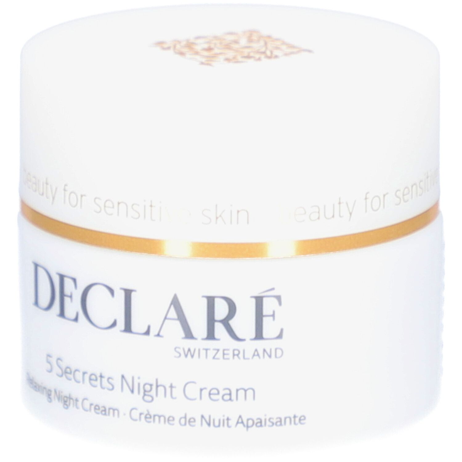Weißer Tiegel mit goldfarbenem Deckel. Aufschrift: DECLARÉ, 5 Secrets Night Cream. Text: Relaxing Night Cream, Crème de Nuit Apaisante.