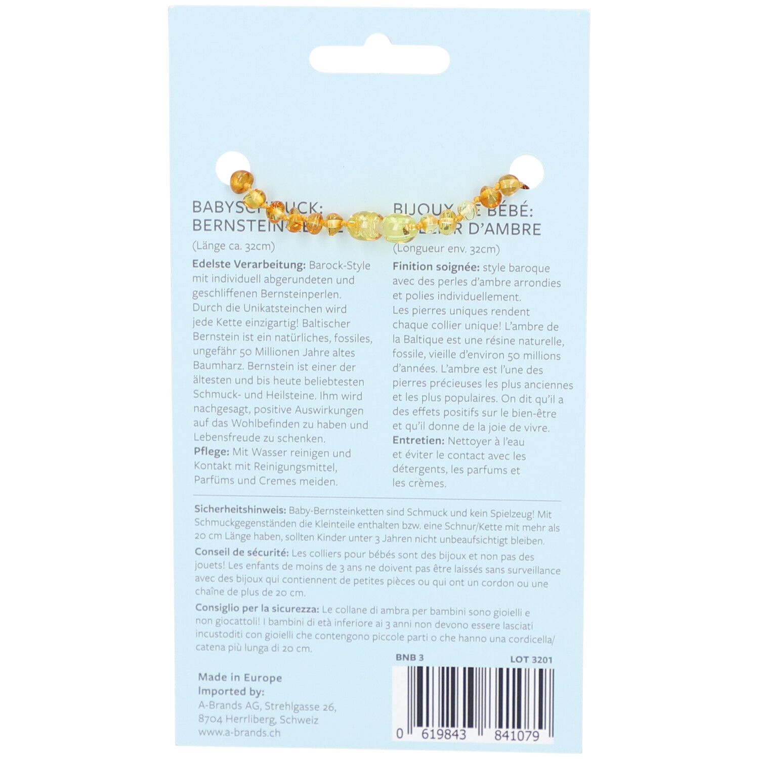 Dos de l'emballage du produit. Informations textuelles sur le collier en ambre, conseils d'entretien et consignes de sécurité.