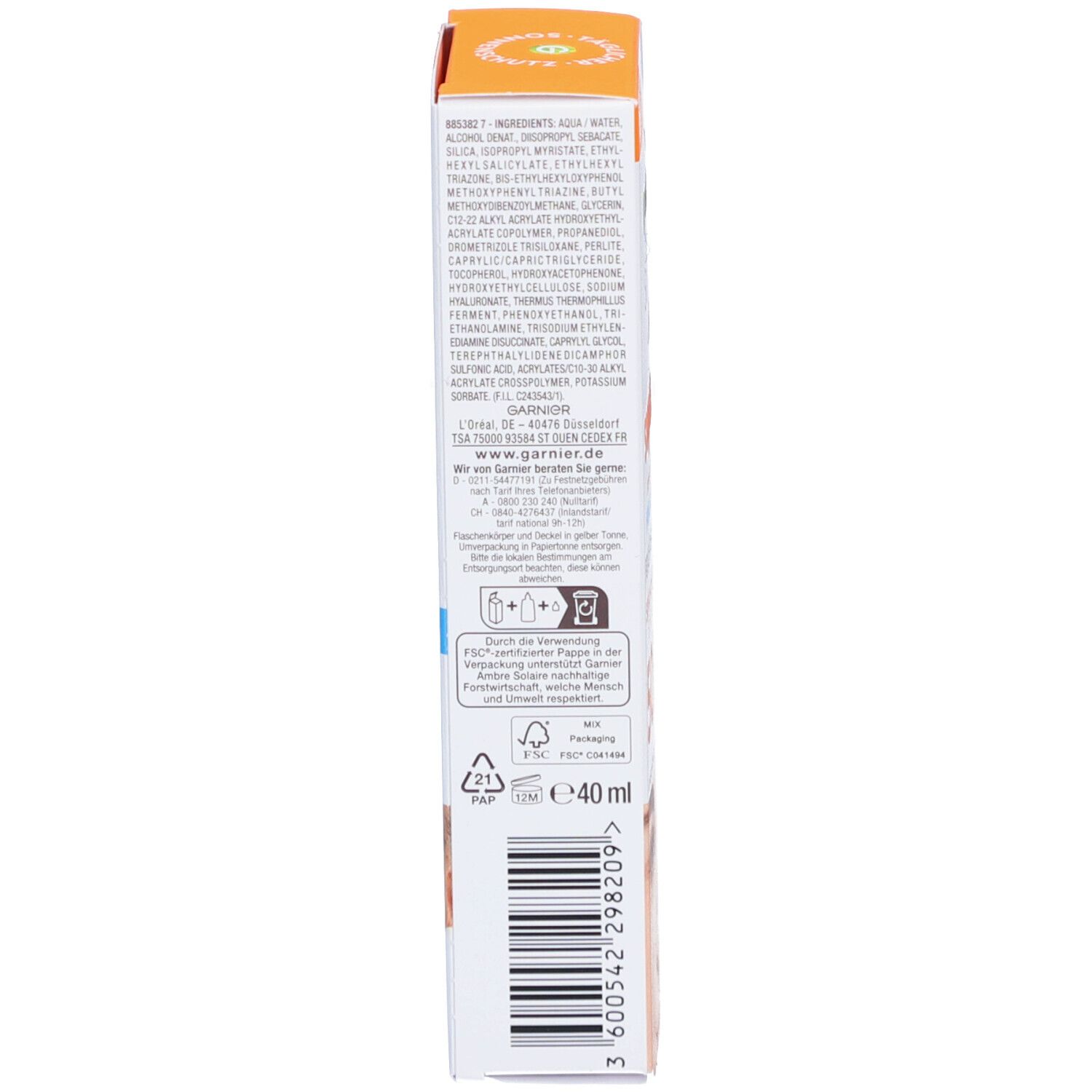 Côté de l'emballage Garnier Ambre Solaire. Texte: Ingrédients, symboles de recyclage, volume 40ml.