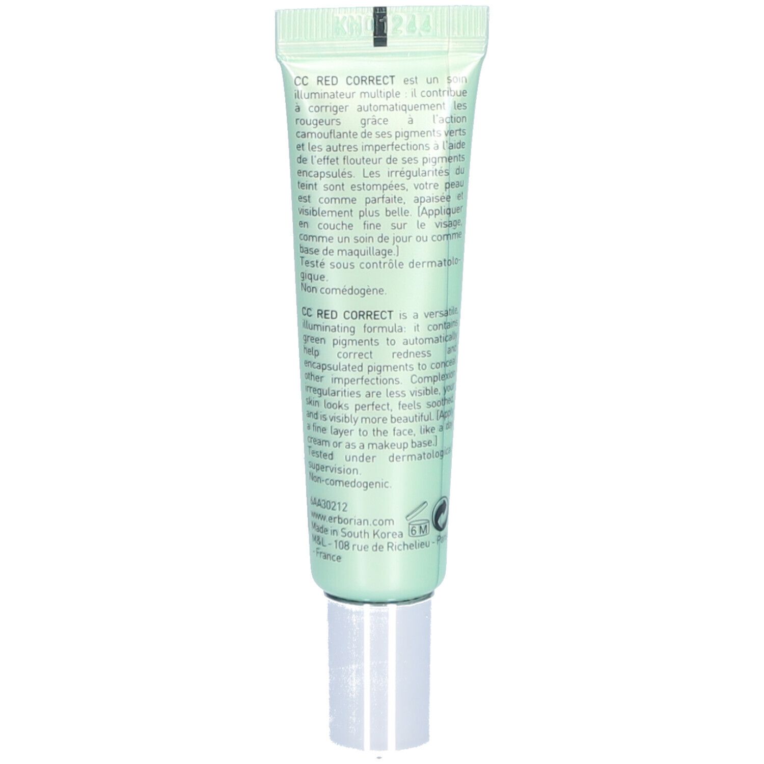 Dos du tube vert. Texte en plusieurs langues. Contient des informations sur le produit et le fabricant.