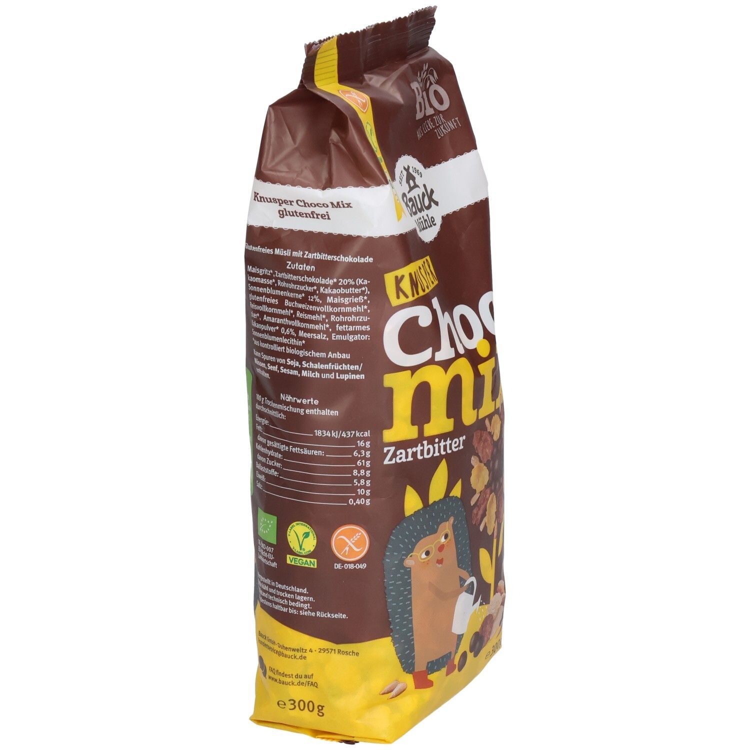 Sachet marron, vue latérale. Inscription "KNUSPER Choco Mix Zartbitter". Logos vegan et bio. Informations nutritionnelles.