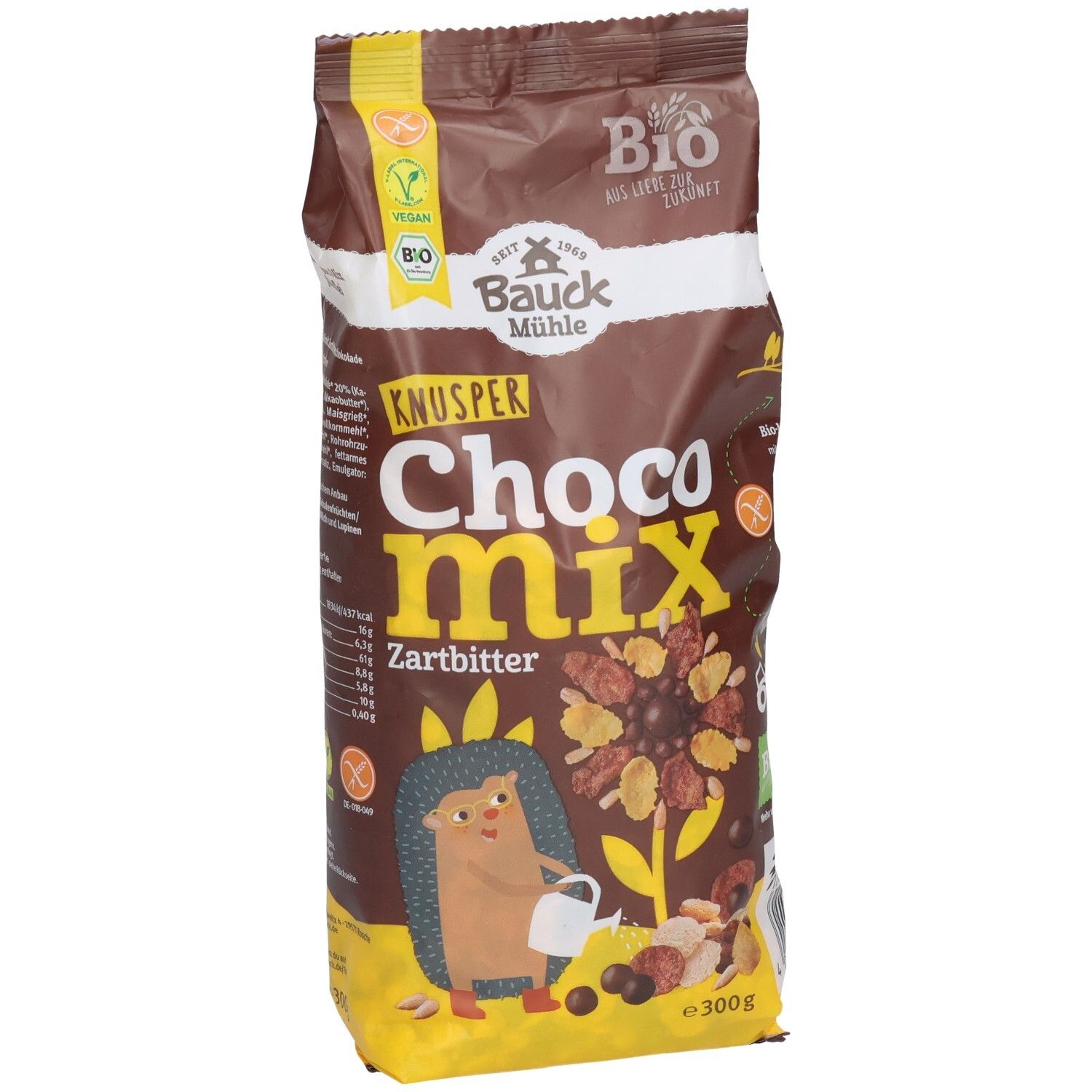 Sachet marron "KNUSPER Choco Mix Zartbitter". Logos vegan et bio. Illustration d'un hérisson et de céréales.
