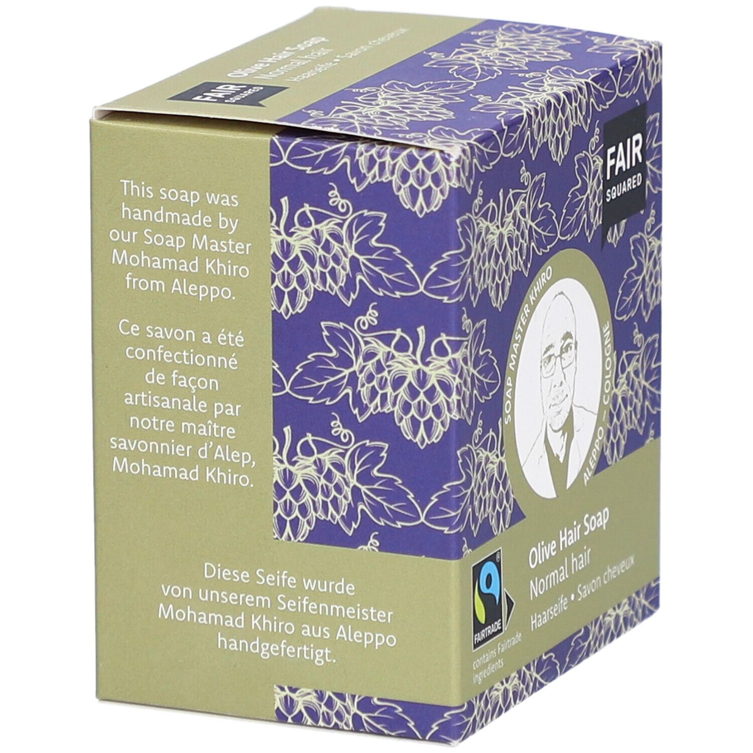 Verpackung FAIR SQUARED Haarseife Olive. Text: handgefertigt von Soap Master Khiro aus Aleppo. Fairtrade-Siegel.