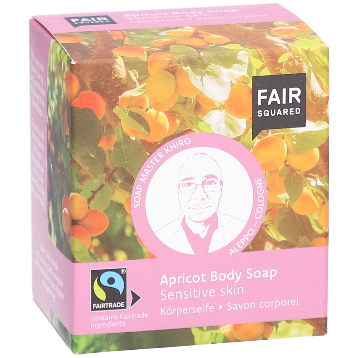Boîte rose avec logo FAIR SQUARED, motif abricot et informations produit. Label Fairtrade.