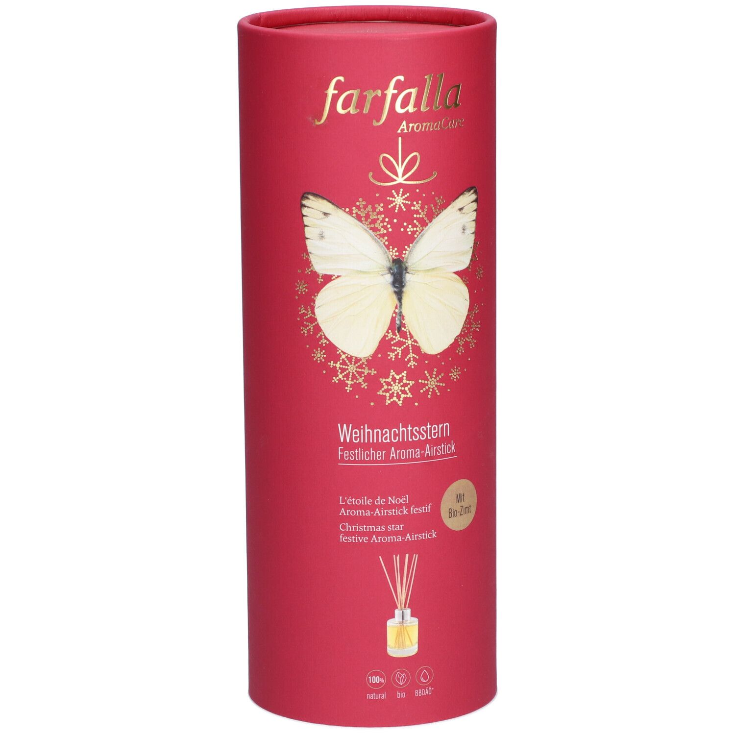 Emballage cylindrique rouge avec texte doré et papillon. Texte: Weihnachtsstern, Aroma-Airstick. En bas: flacon avec bâtonnets.