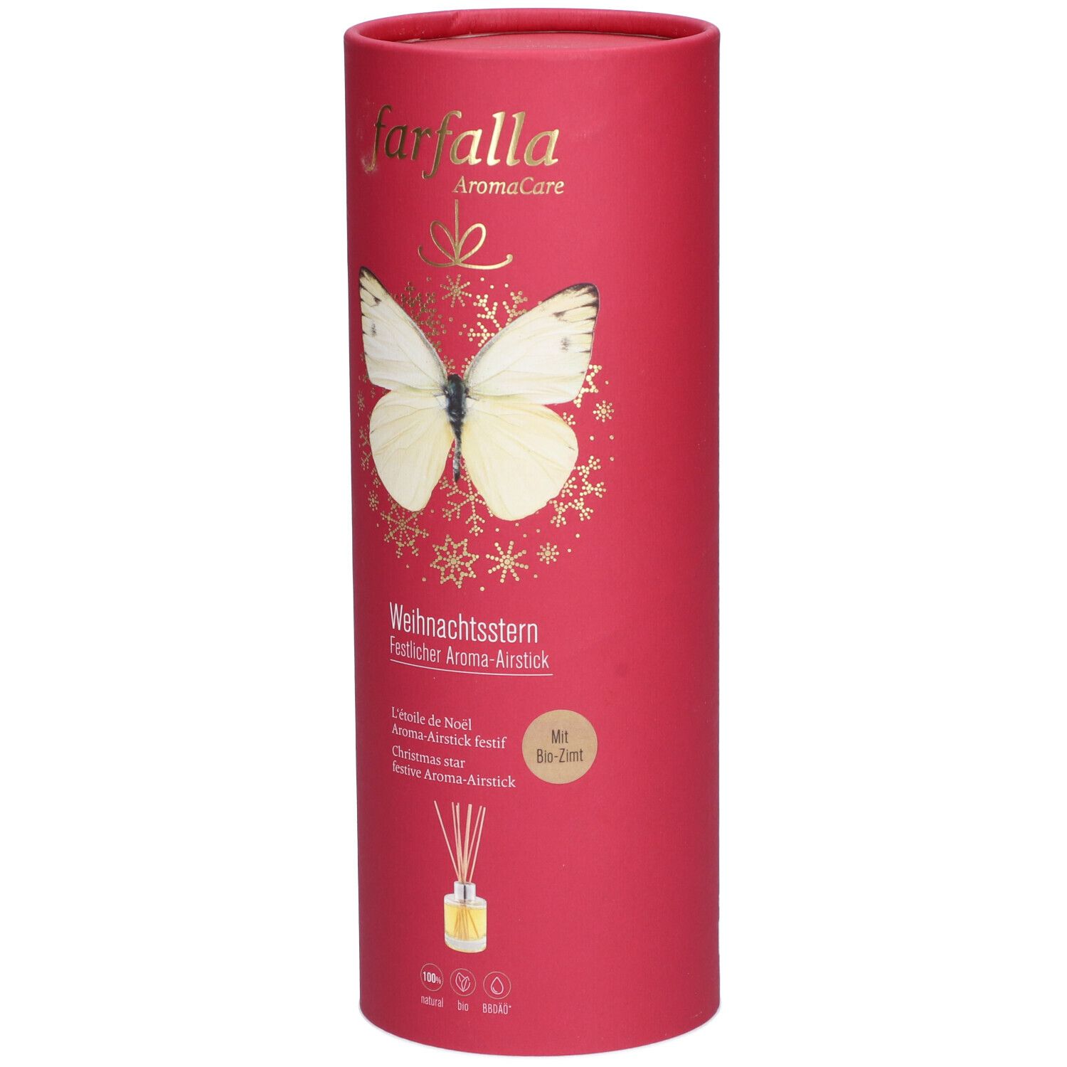 Emballage cylindrique rouge avec texte doré et papillon. Texte: Weihnachtsstern, Aroma-Airstick. En bas: flacon avec bâtonnets.