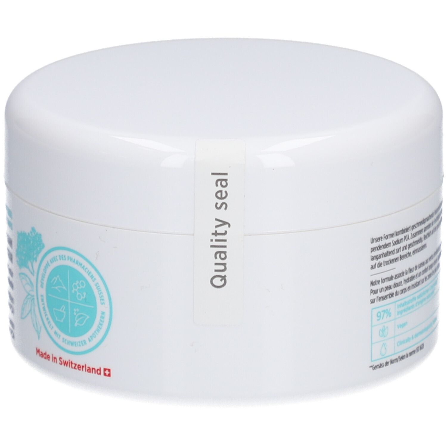 Weißer Tiegel mit Deckel. Aufkleber: Quality seal. Text und floralem Design auf der Seite.