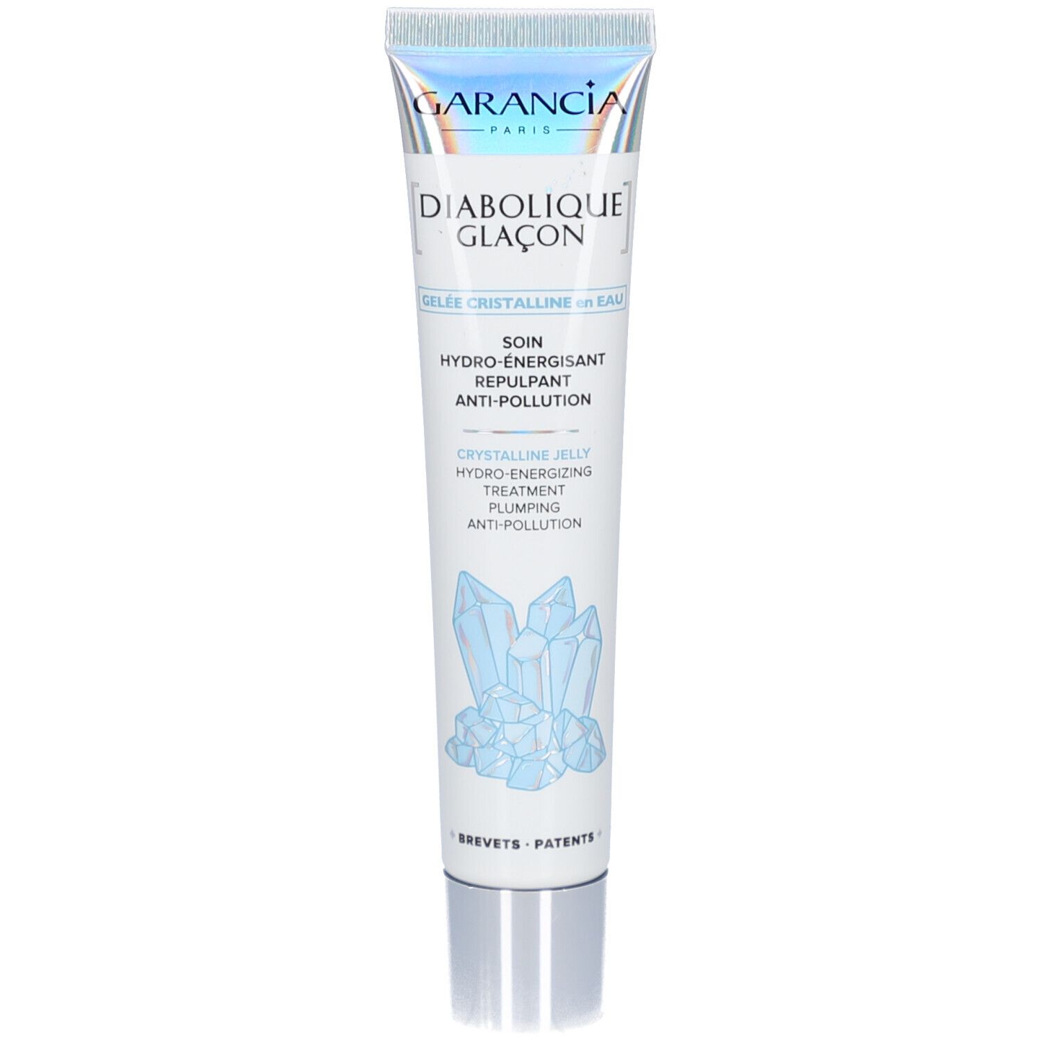 Tube blanc avec nom du produit et logo. Cristaux bleus illustrés. Texte en français.