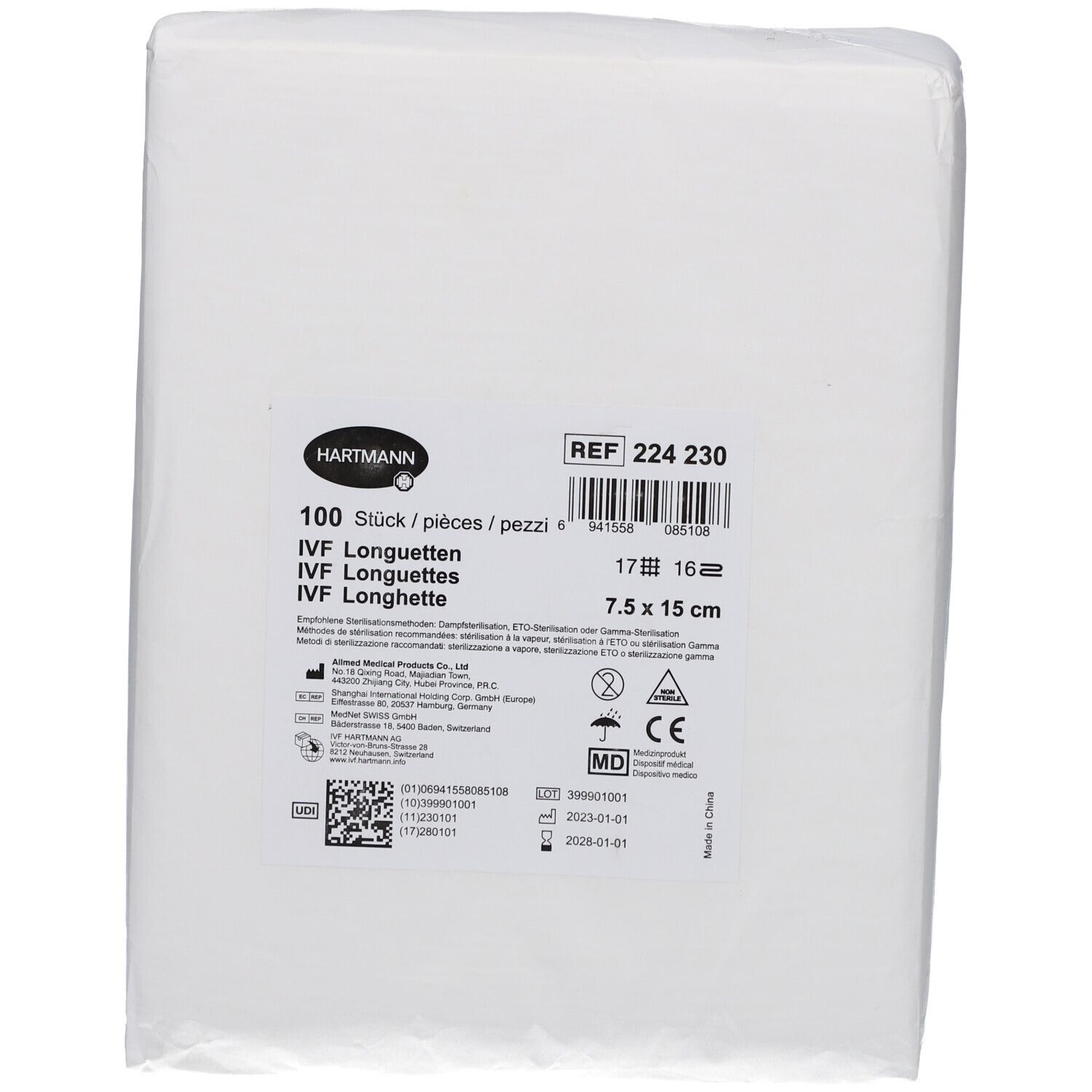 Weißes, rechteckiges Paket mit medizinischen Longuetten. Aufdrucke: HARTMANN, IVF Longuetten, REF 224 230, 7.5 x 15 cm, 100 Stück, CE-Zeichen.