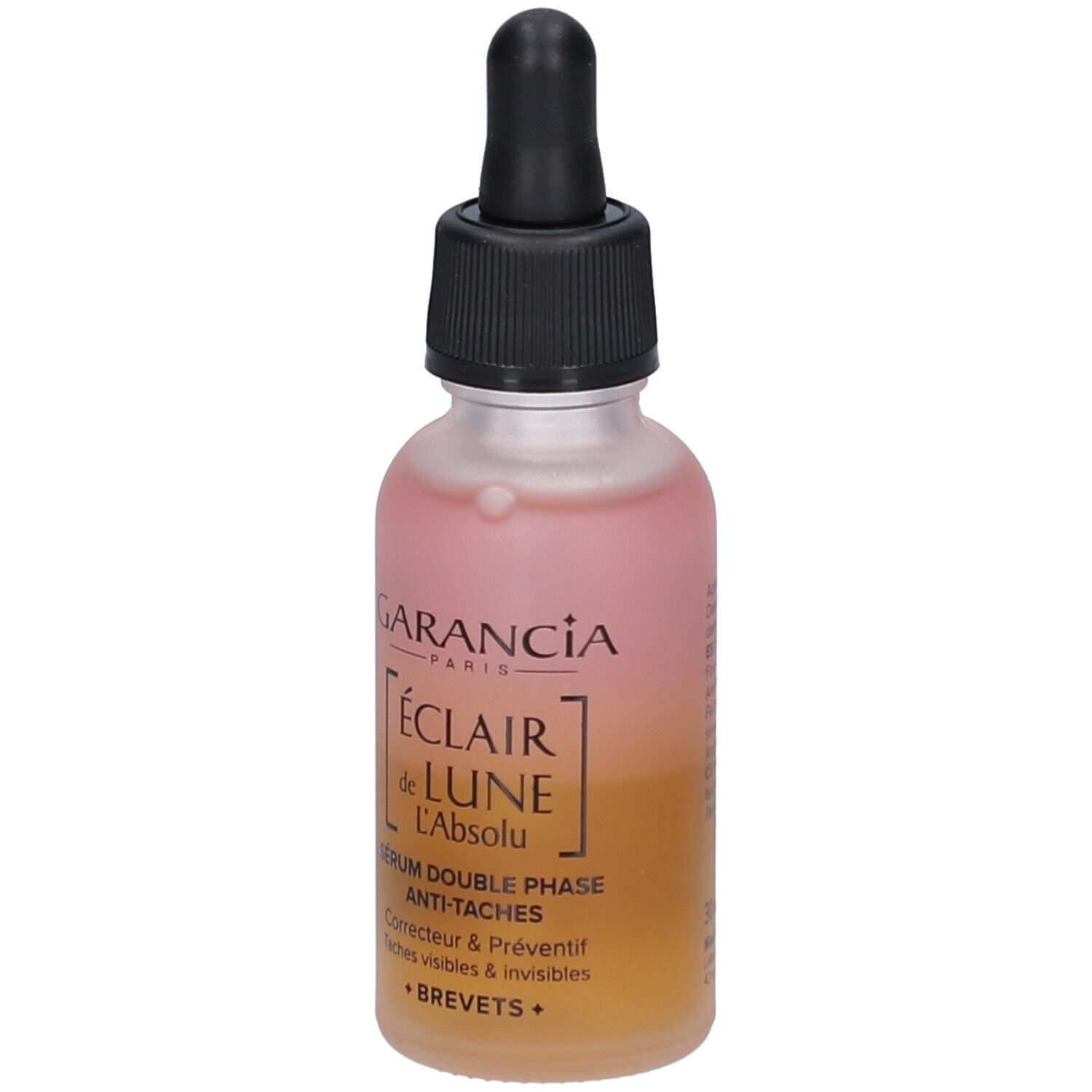 Garancia Serumflasche mit Pipette. Rosa-gelbe Flüssigkeit. Schwarzer Deckel. Text: Éclair de Lune, Anti-Taches.