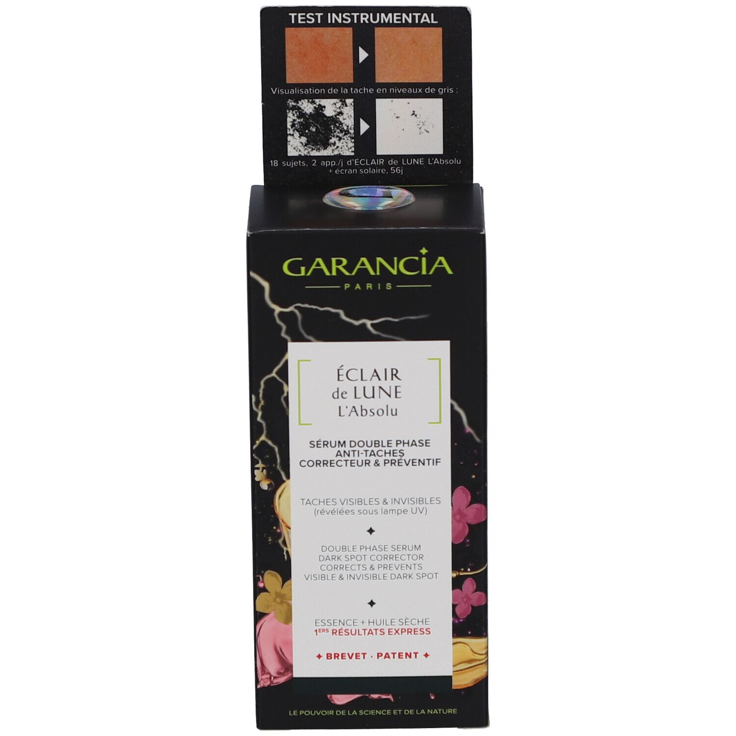 Garancia Serumflasche und Verpackung. Rosa-gelbe Flüssigkeit. Schwarzer Deckel. Text: Éclair de Lune, Anti-Taches.