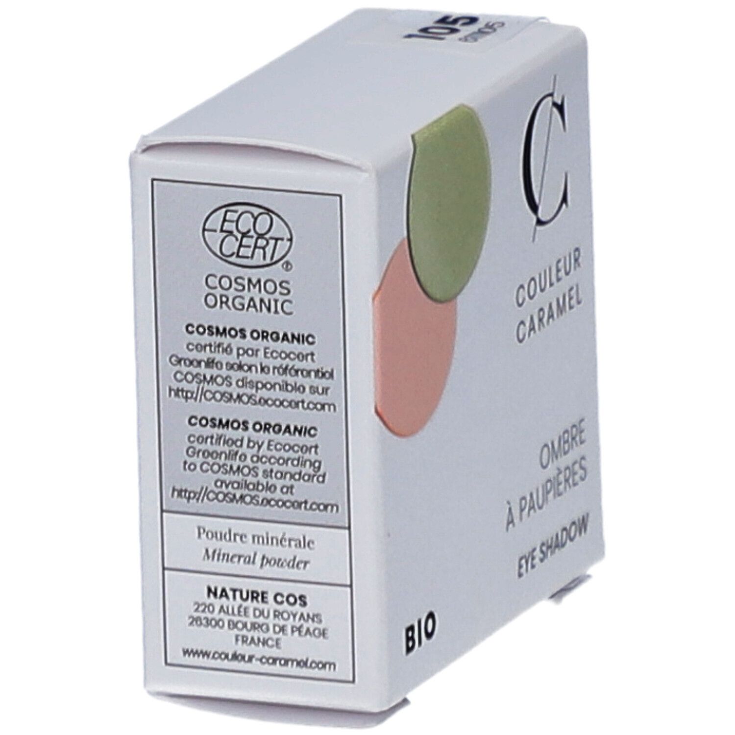 Boîte blanche avec fard à paupières. Marque COULEUR CARAMEL, BIO. Deux couleurs rondes de fard à paupières. Texte : Ombre à paupières. Certification : COSMOS ORGANIC.