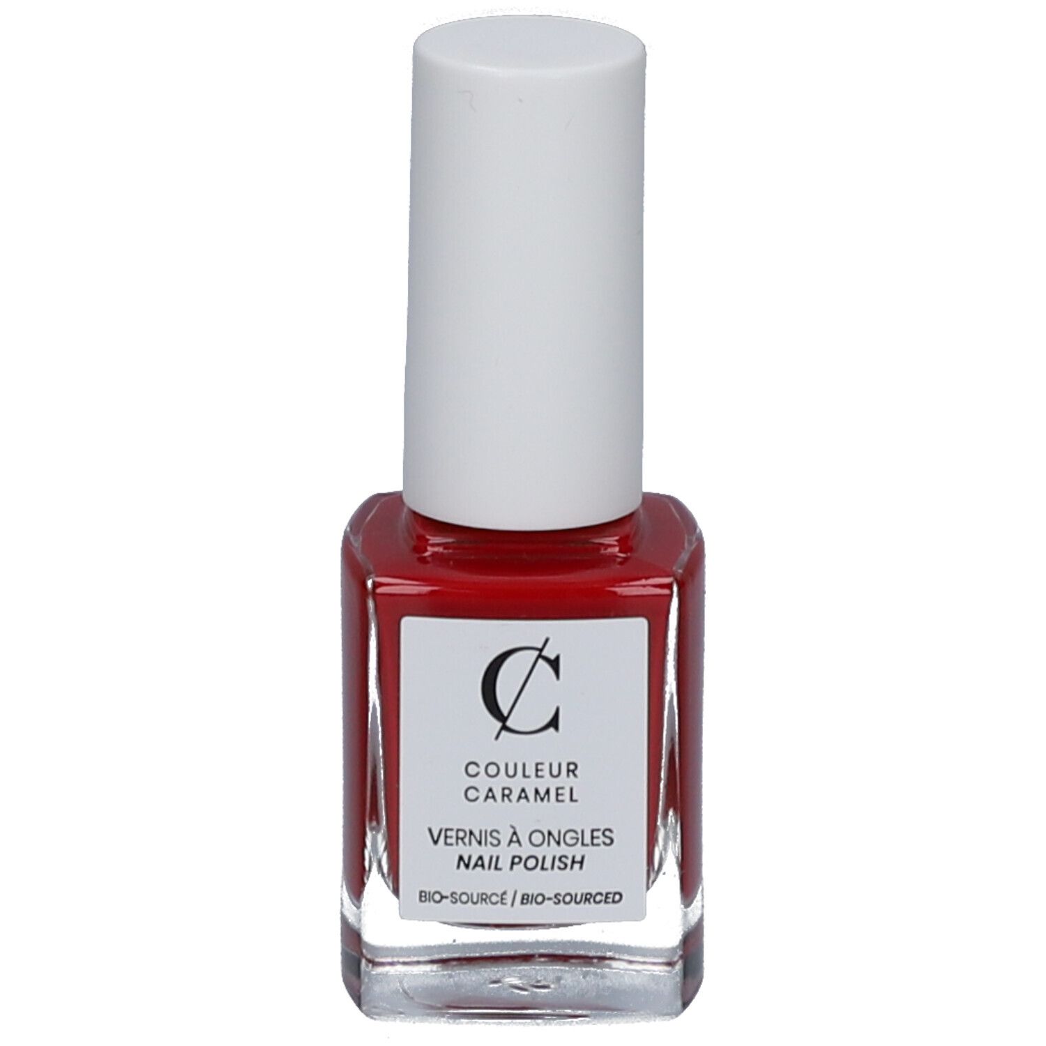 Flacon de vernis à ongles rouge avec bouchon blanc. Étiquette avec logo et texte COULEUR CARAMEL, Vernis à ongles, Bio-Source.