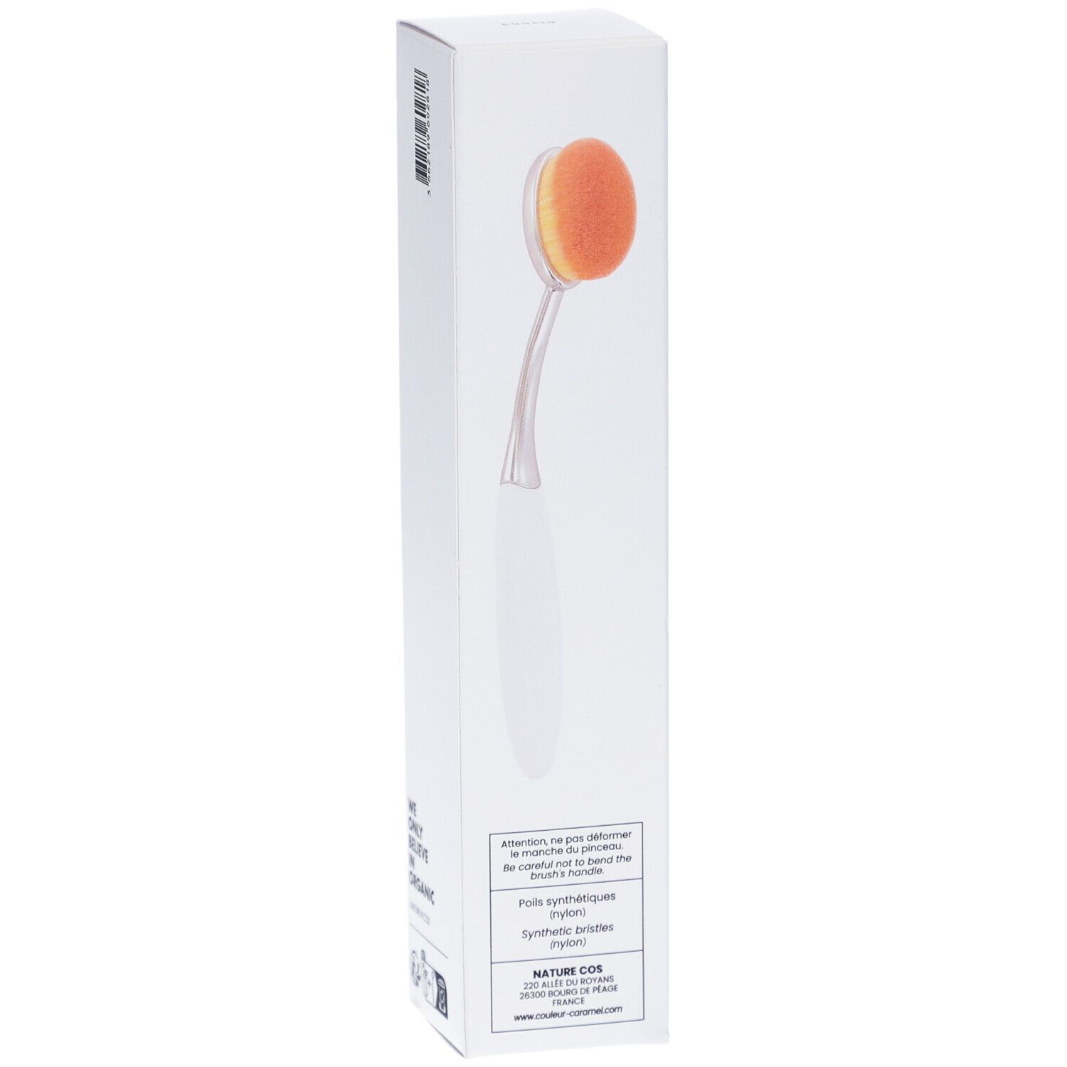 Pinceau teint n°19 dans un emballage blanc. Le pinceau a une tête ovale orange et un manche blanc. "NATURE COS" est écrit sur l'emballage.