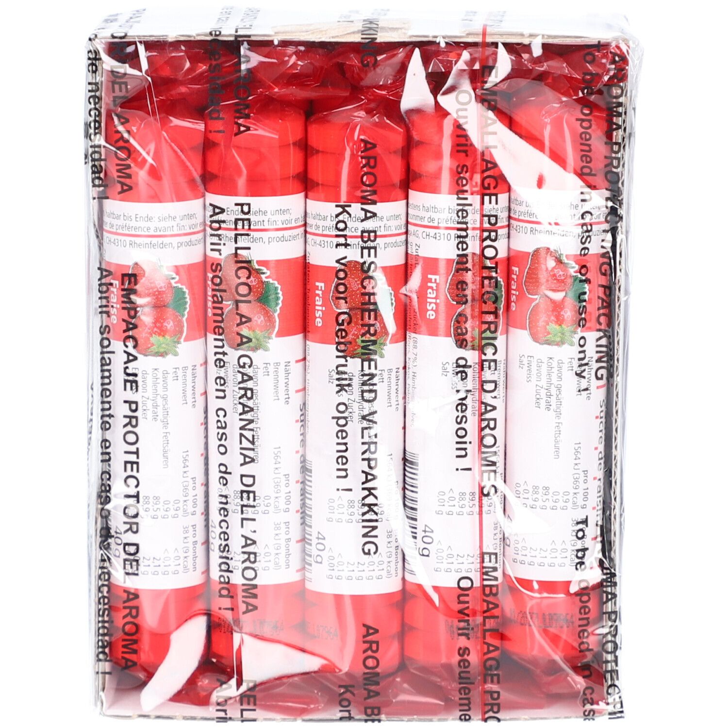 Packung mit zylinderförmigen, roten Rollen. Aufdrucke in mehreren Sprachen, darunter Erdbeere und 40g.