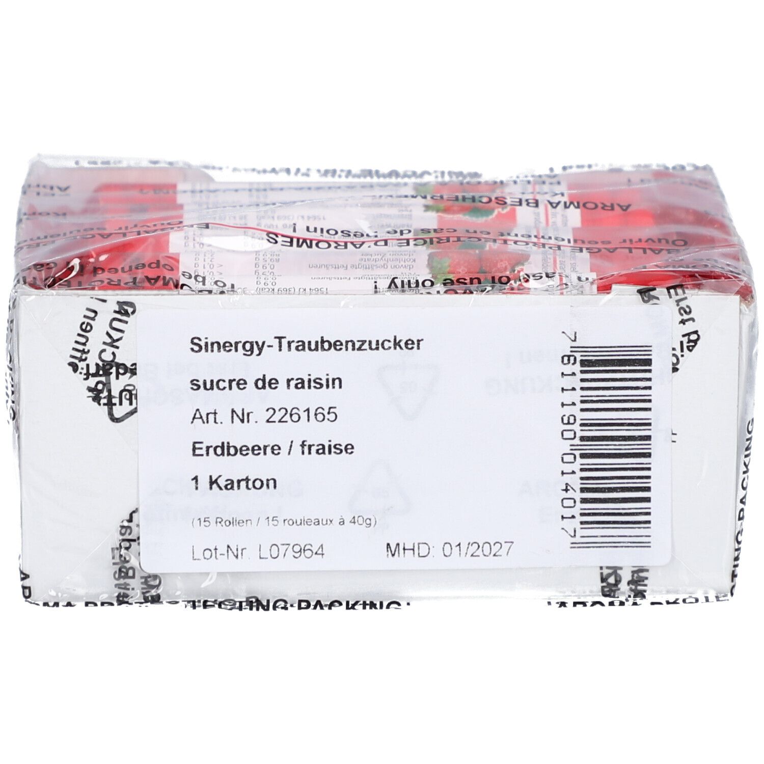 Karton mit Aufdrucken. Enthält Text wie 'Sinergy-Traubenzucker', 'Erdbeere / fraise' und '1 Karton'.