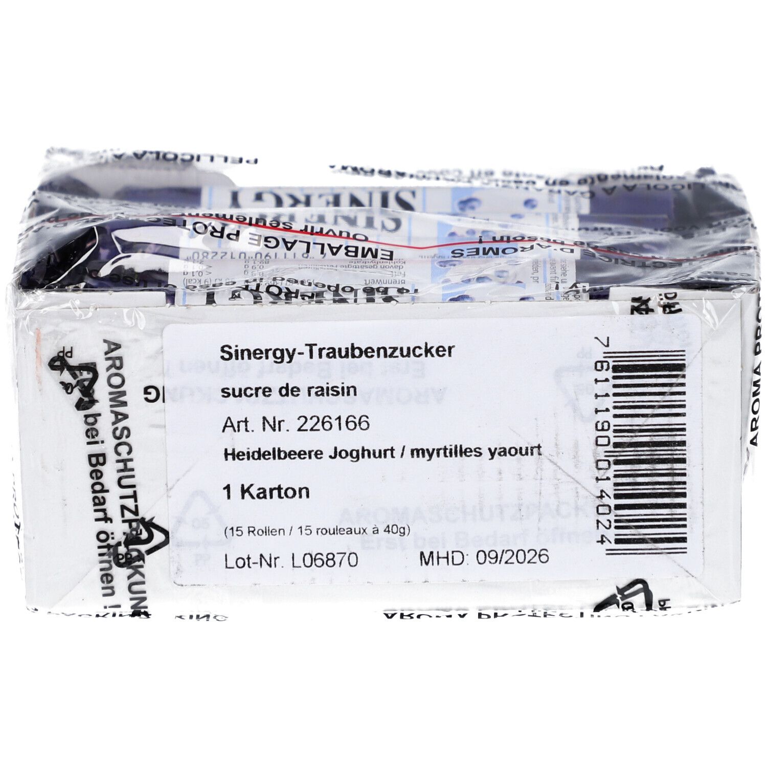 Karton mit SINERGY-Traubenzucker. Enthält 15 Rollen. Produktname, Artikelnummer, MHD und Barcode sind sichtbar.