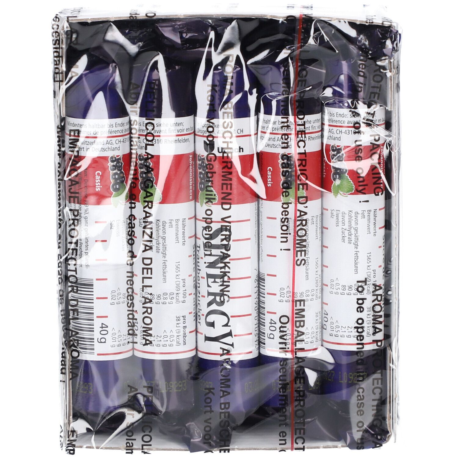 Paquet de six bâtonnets SINERGY Traubenzucker. Emballage bleu et blanc avec texte rouge. Film transparent.