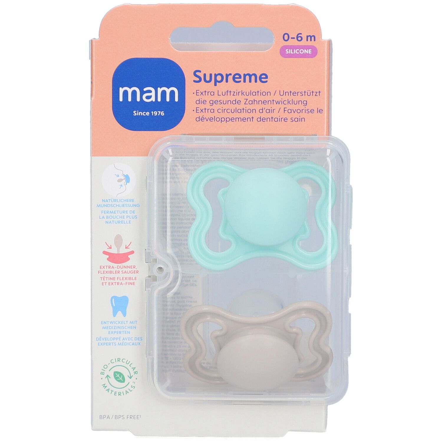 Verpackung mit zwei Schnullern. Hellblauer und beiger Nuggi in Plastikbox. Marke MAM, 0-6m, Supreme.