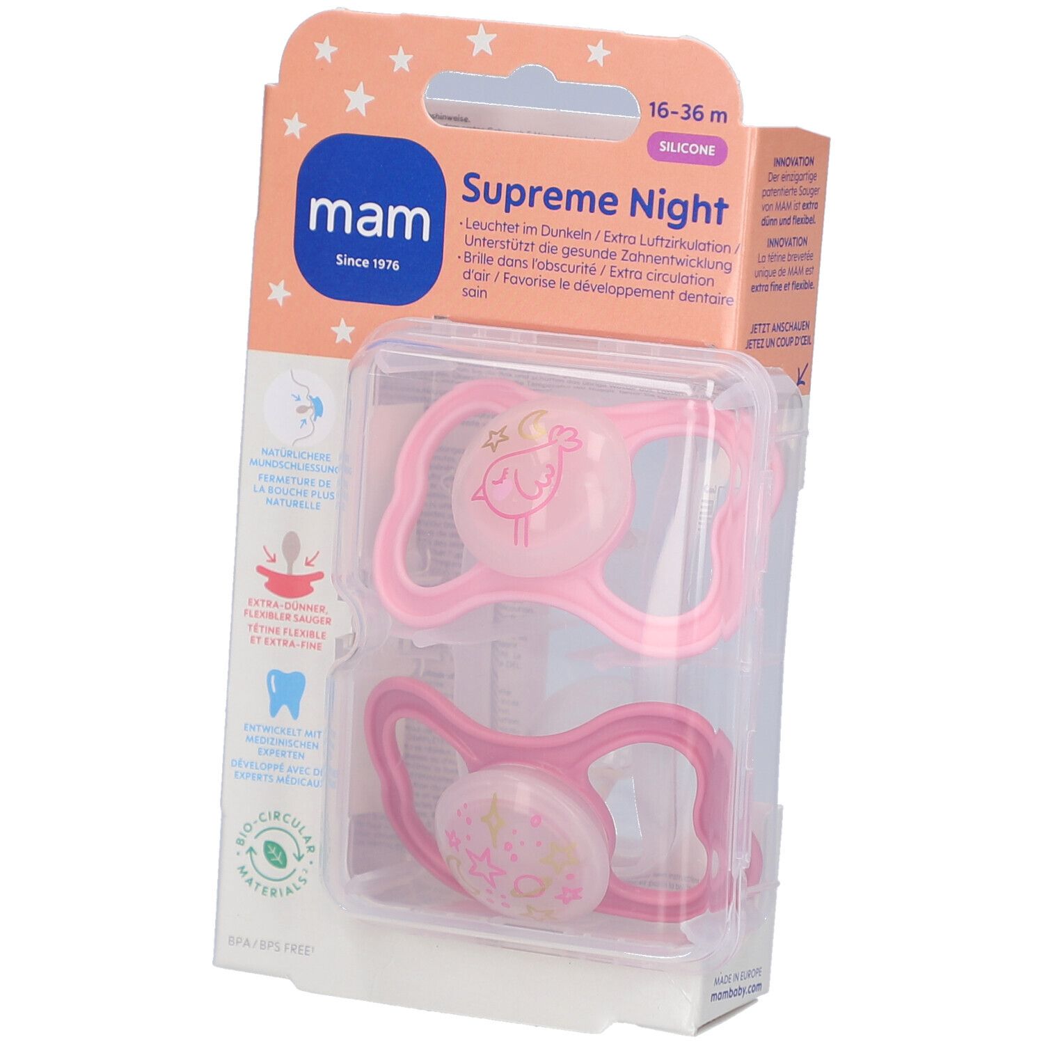 Verpackung mit zwei rosa Schnullern. Marke: mam. Text: Supreme Night, 16-36 m, Silikon. Sichtbare Illustrationen.