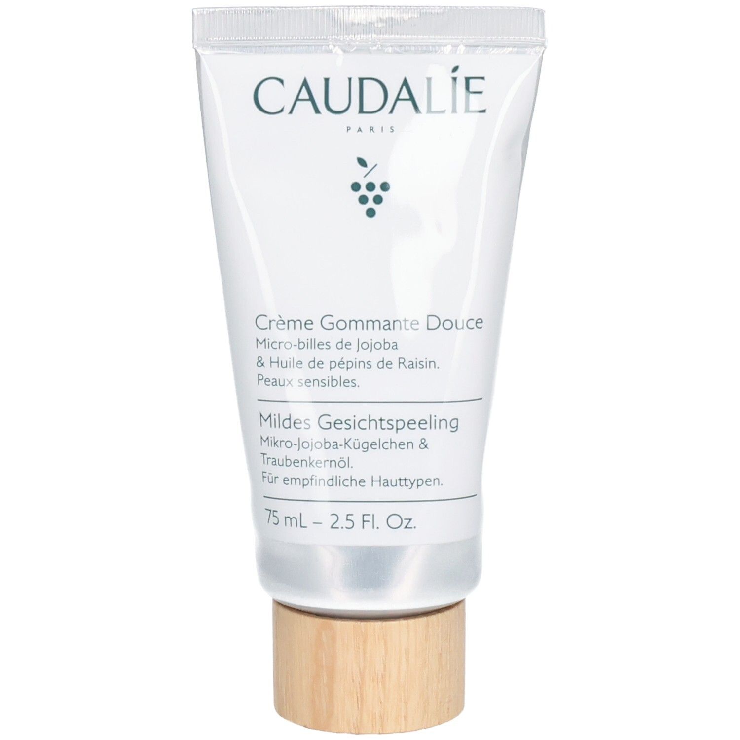 Creme-Peeling-Tube. Weiß, mit Schriftzug CAUDALÍE und Produktbezeichnung. Holzfarbener Drehverschluss.