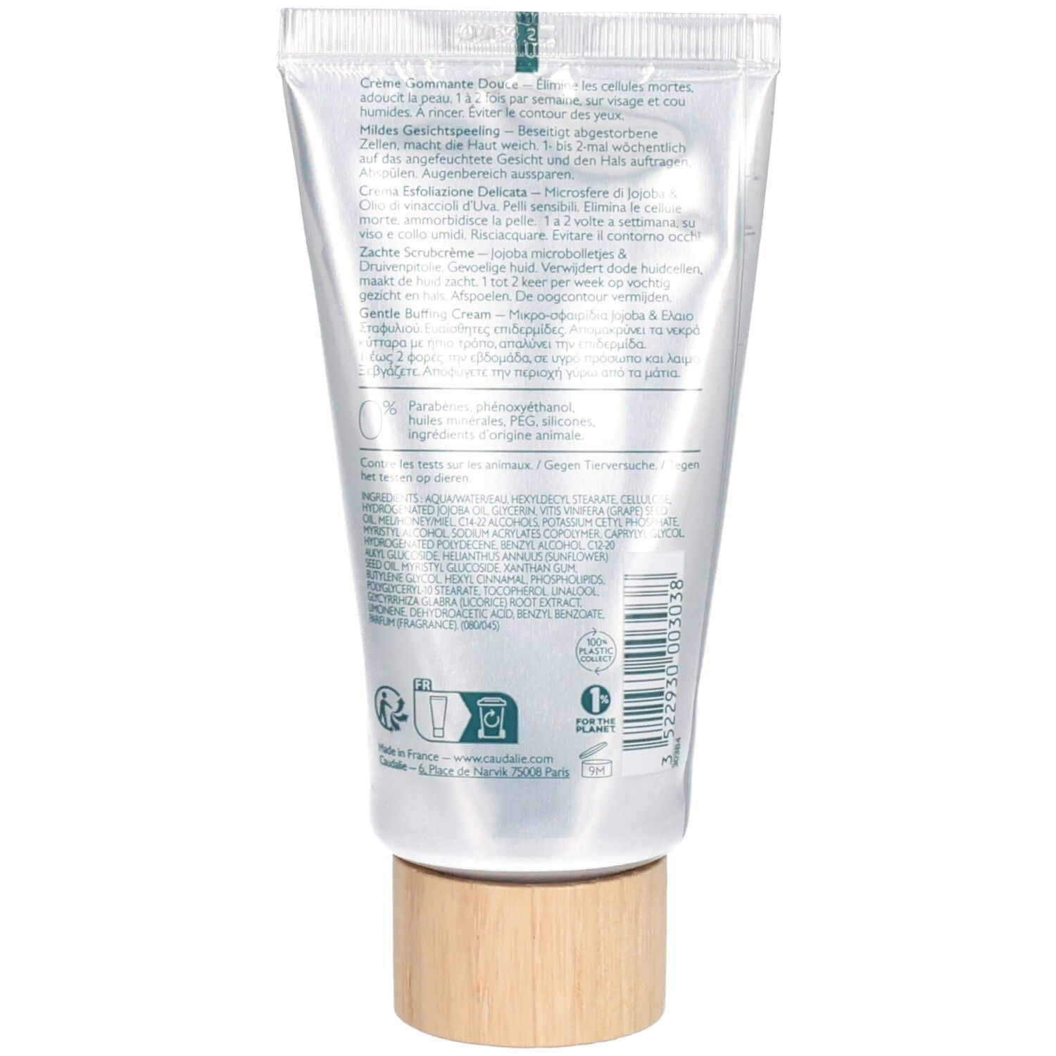 Rückseite der Creme-Peeling-Tube. Text in mehreren Sprachen. Holzfarbener Drehverschluss.