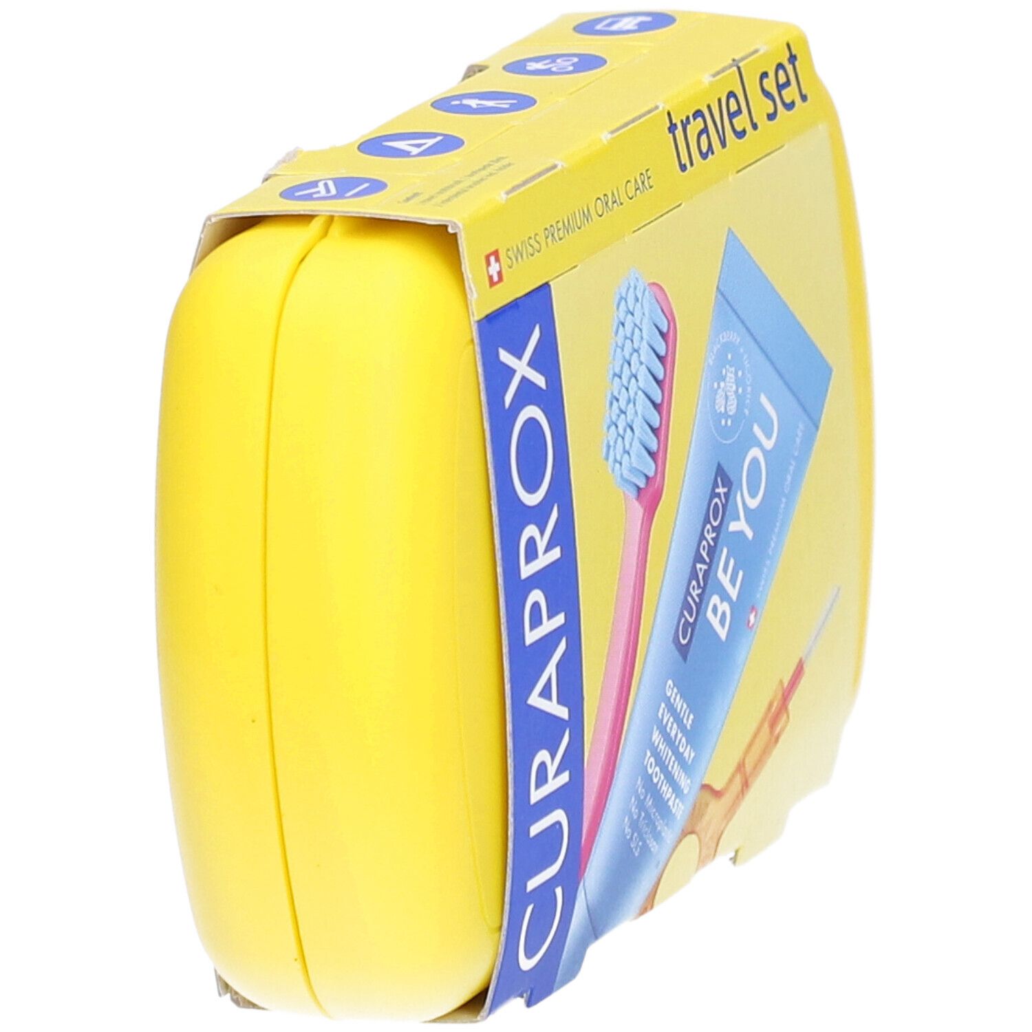 Gelbes CURAPROX Travel Set, teilweise verpackt. Enthält Zahnbürste, Zahnpasta und Interdentalbürste.