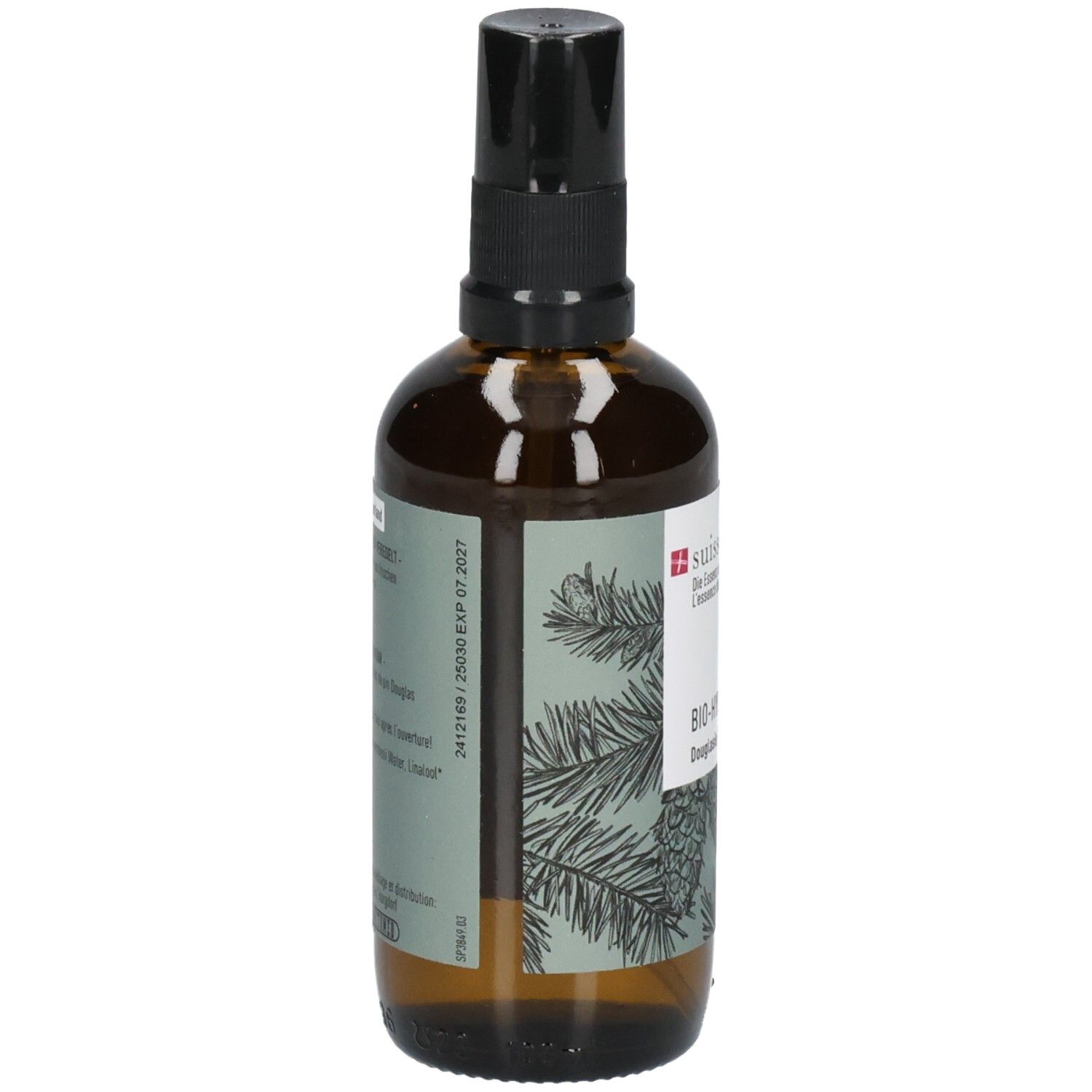Braune Sprühflasche mit schwarzem Zerstäuberaufsatz. Etikett mit Tannenzweigen und Text.