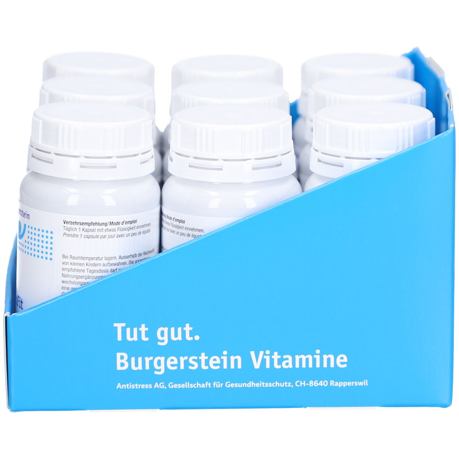 Blaues Tablett mit Flaschen. Auf der Rückseite steht Burgerstein Vitamine. Text in Deutsch.