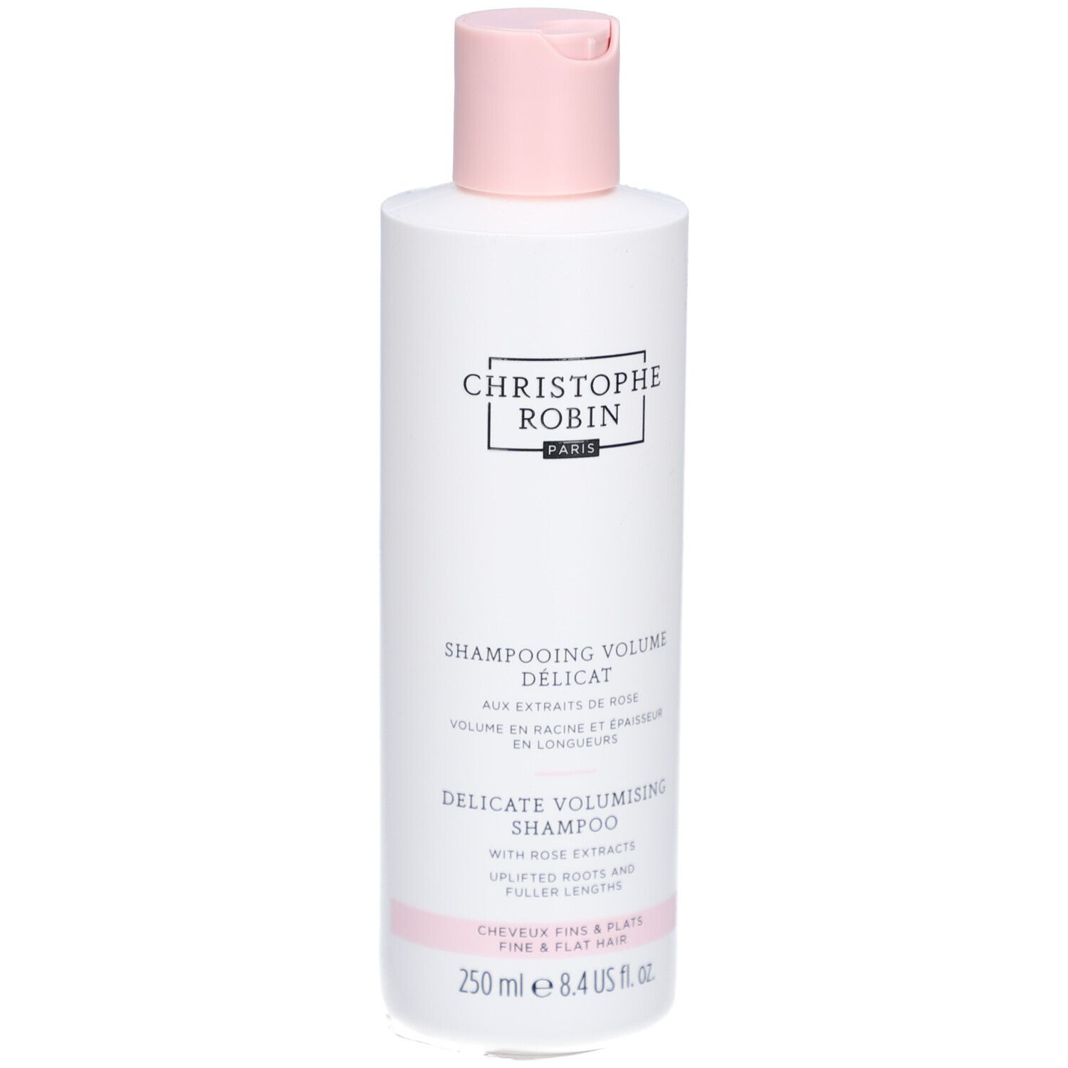 Flacon de shampooing blanc avec bouchon rose. Texte: Christophe Robin, Shampooing Délicat Volume Aux Extraits De Rose, 250 ml.