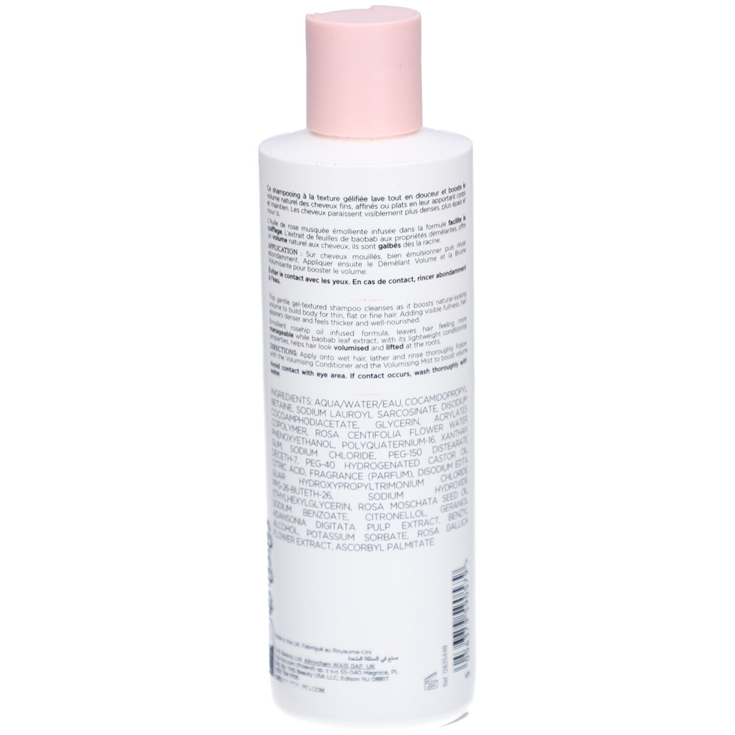 Dos du flacon de shampooing. Texte avec ingrédients et instructions. Flacon blanc avec détails roses.