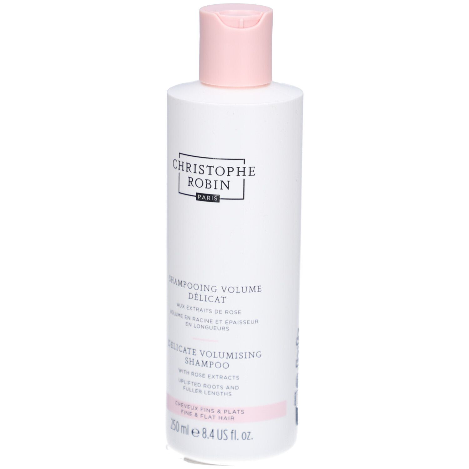 Flacon de shampooing blanc avec bouchon rose. Texte: Christophe Robin, Shampooing Délicat Volume, 250 ml.