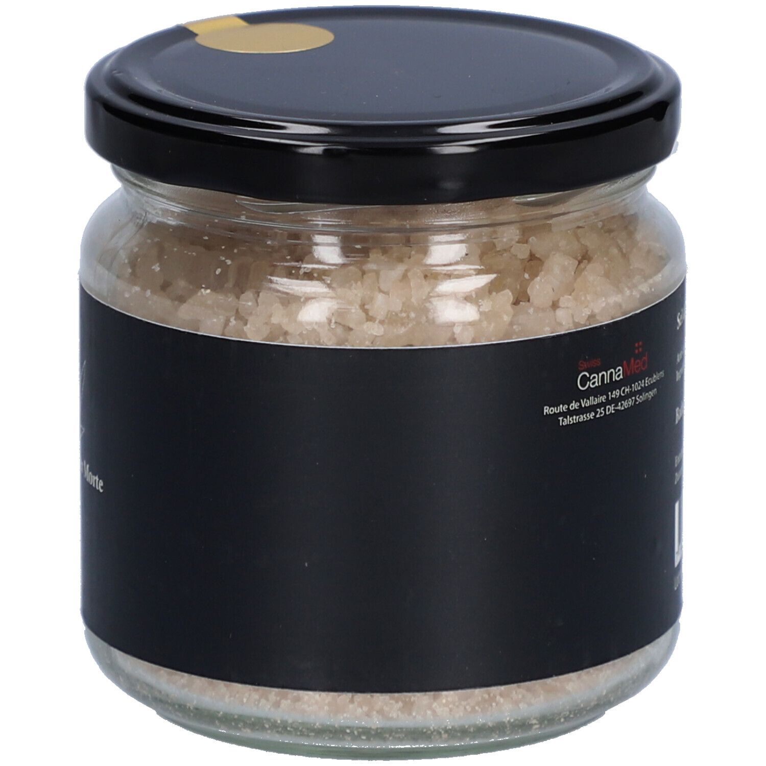 Glas mit Badesalz. Schwarzes Etikett mit CannaMed-Logo und Produktinformationen. Schwarzer Deckel mit goldenem Siegel.