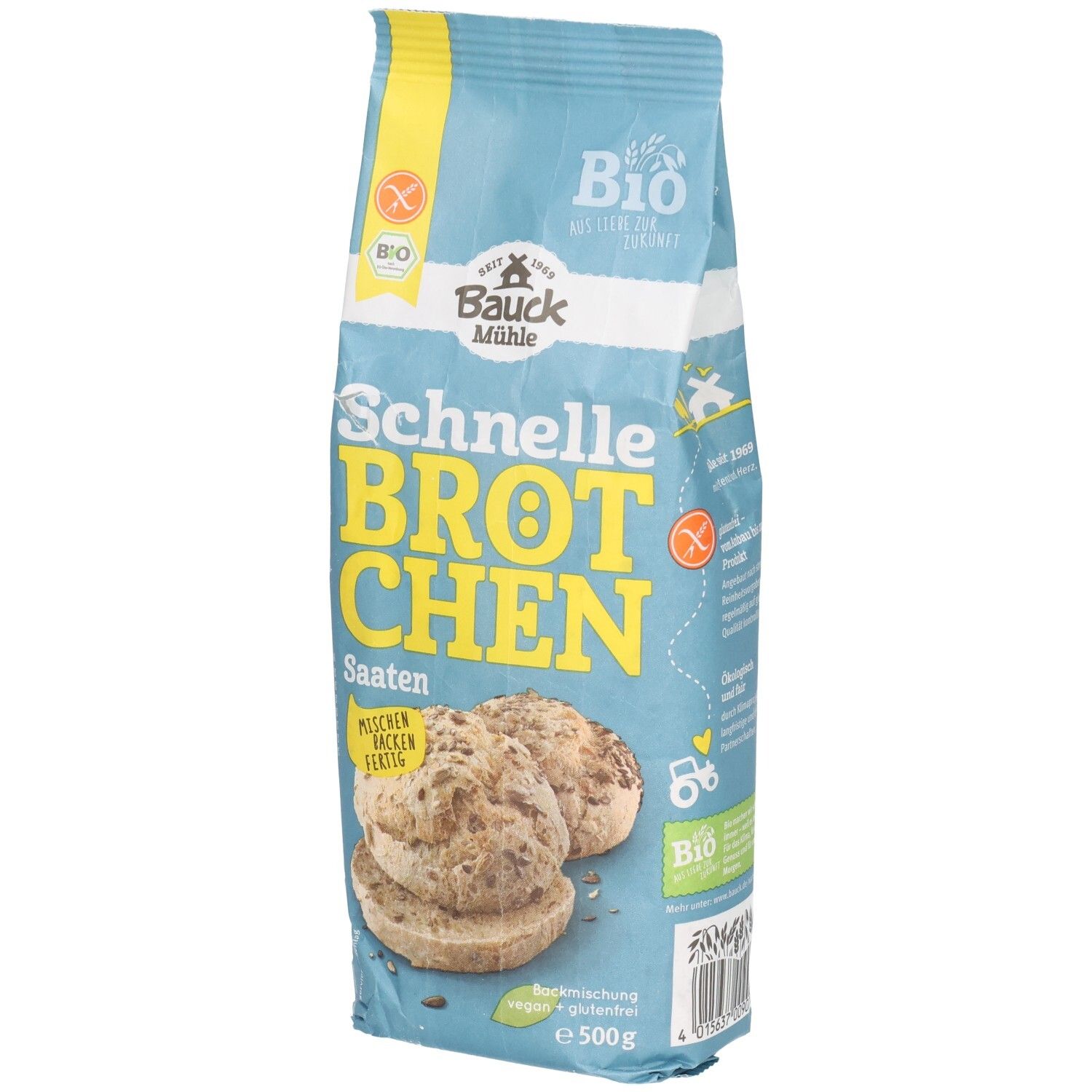 Emballage bleu clair avec l'inscription "Schnelle Brötchen Saaten". Label bio et symbole sans gluten. Illustration de petits pains aux graines.